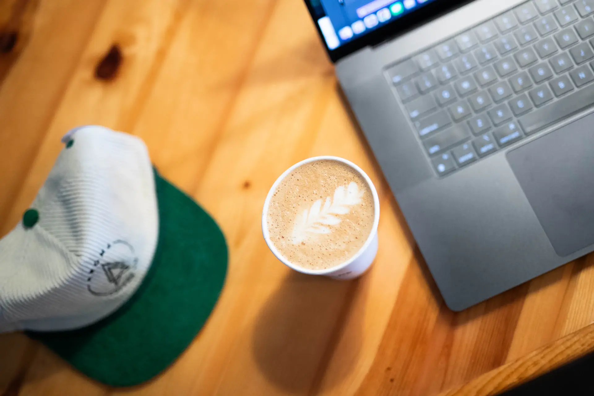 Freelancer working in a sunlit cafe