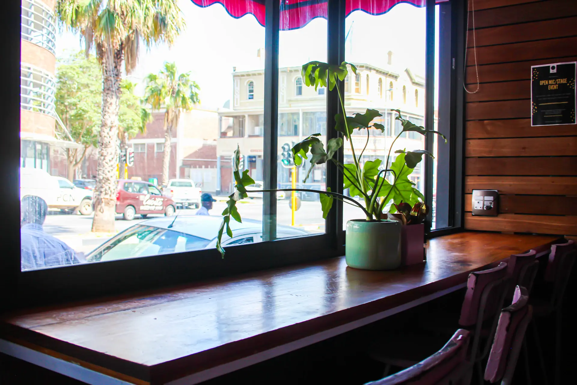 Main room with communal table and window booths