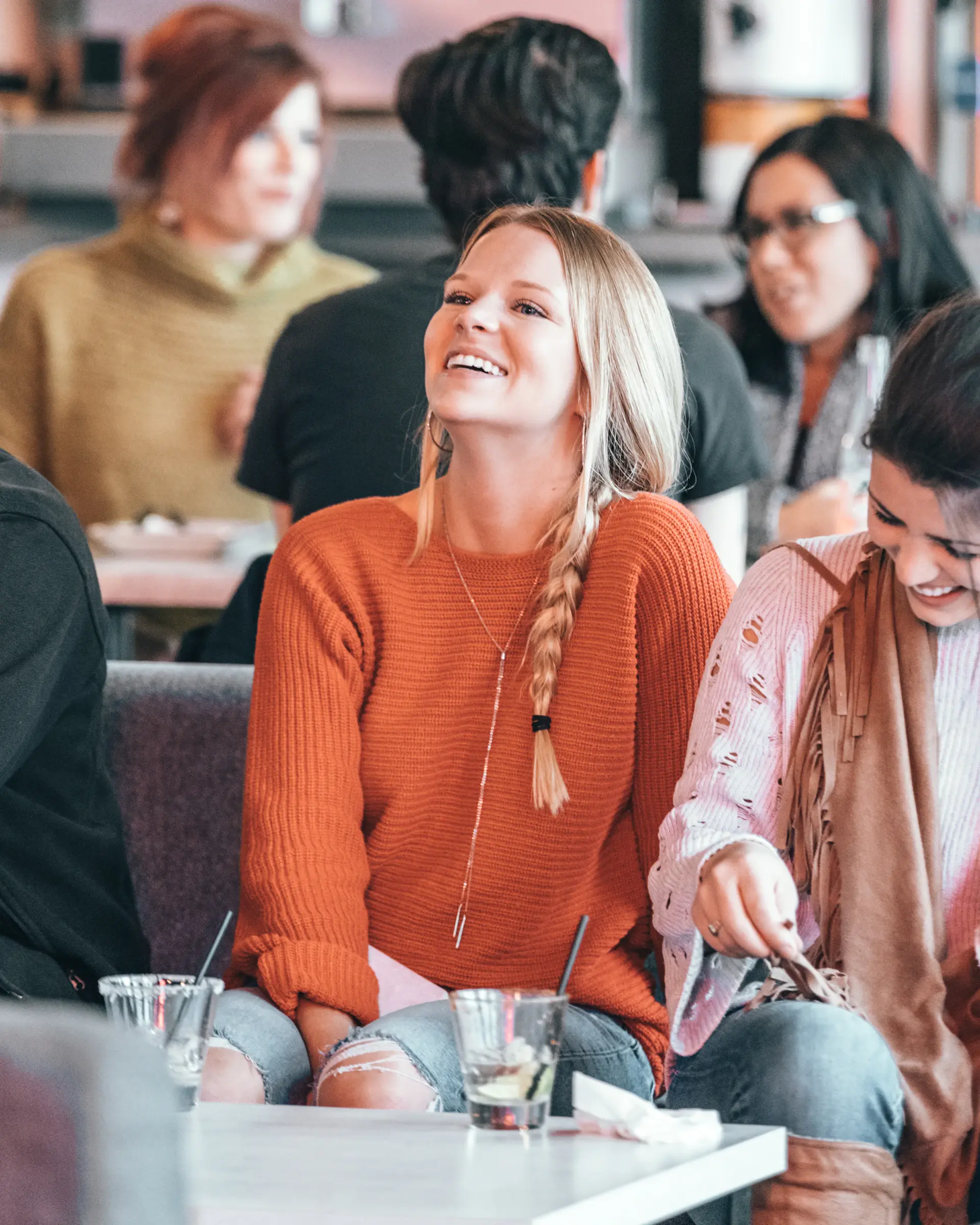 Colleagues laughing during a team lunch