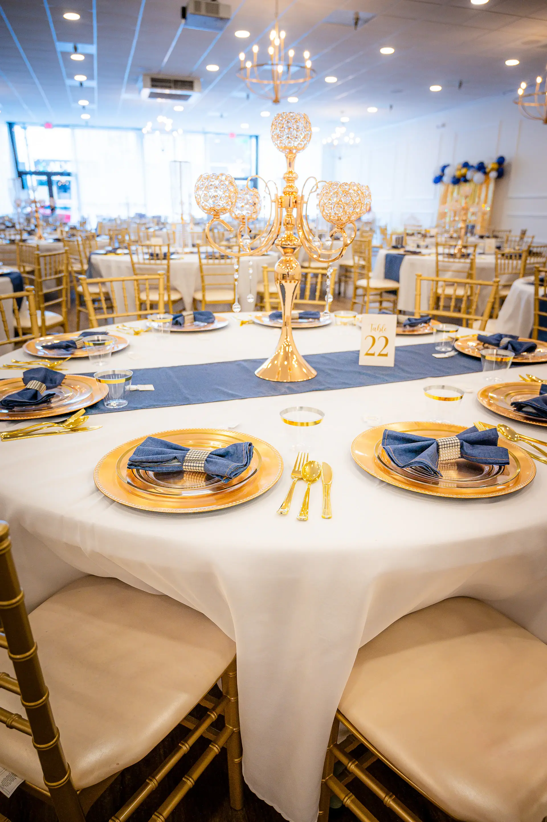 Staff preparing a palace ballroom before a wedding