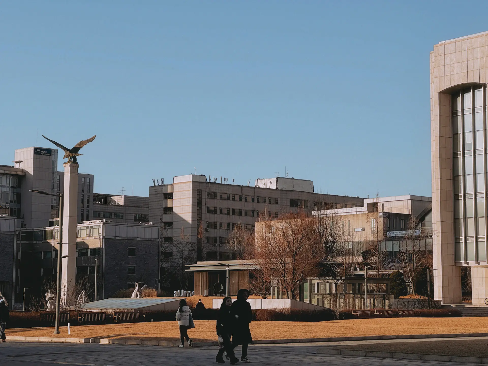 Seoul university campus at golden hour with students walking