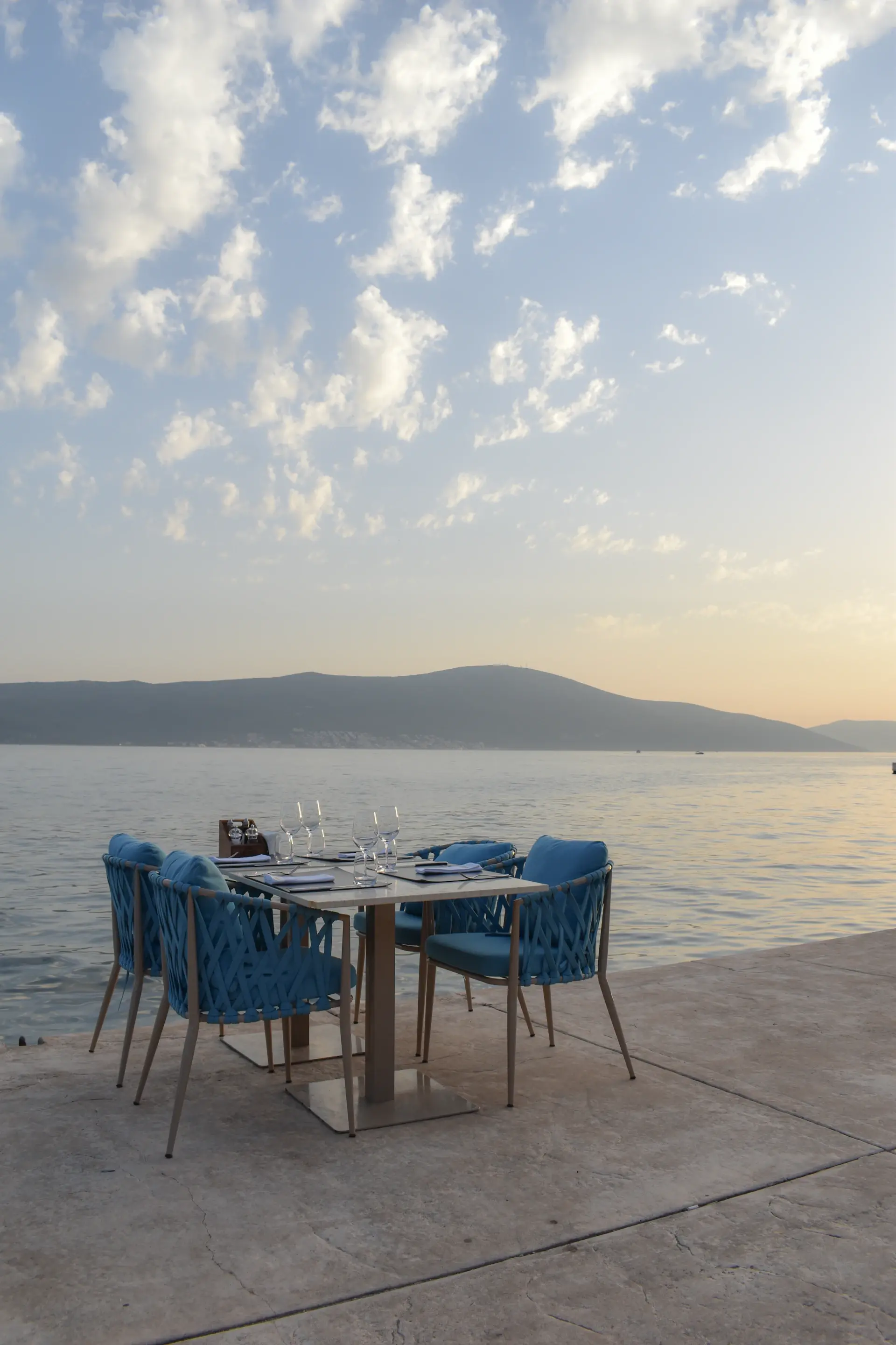 A private dining terrace set above the sea