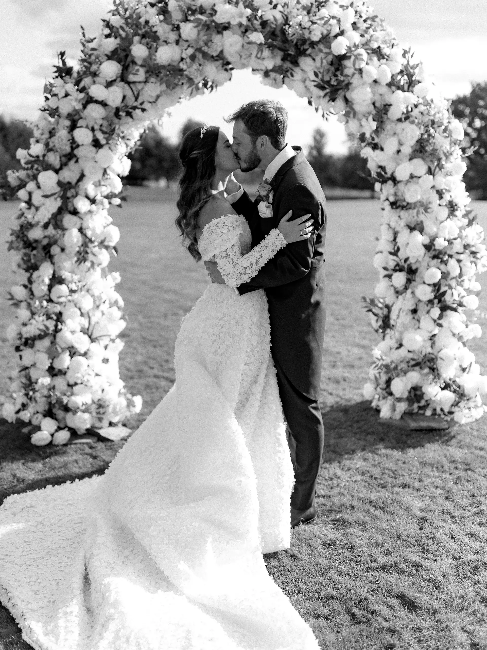 Couple beneath a floral arch