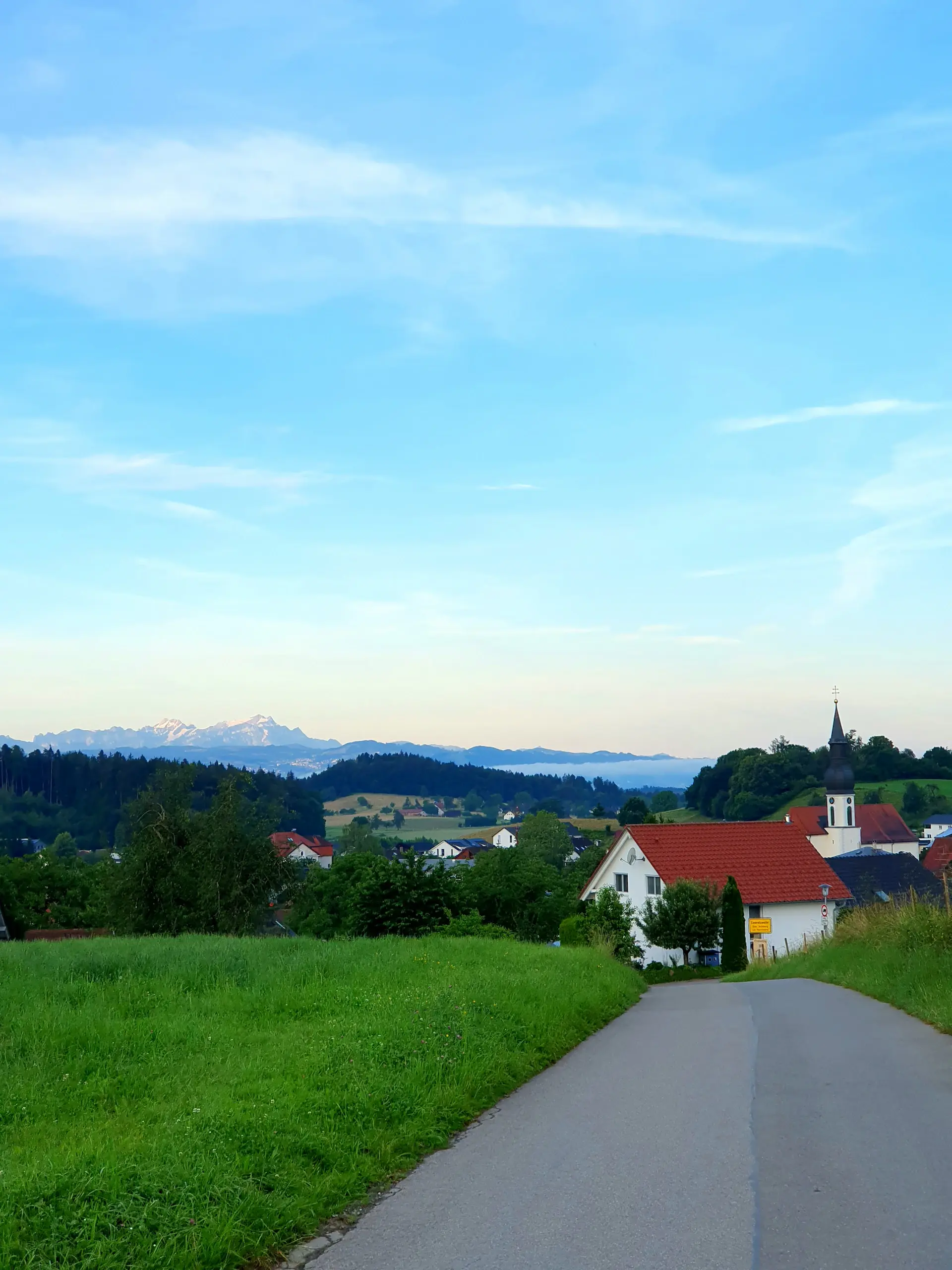 A luxury motorcar on Bavaria's Romantic Road through countryside