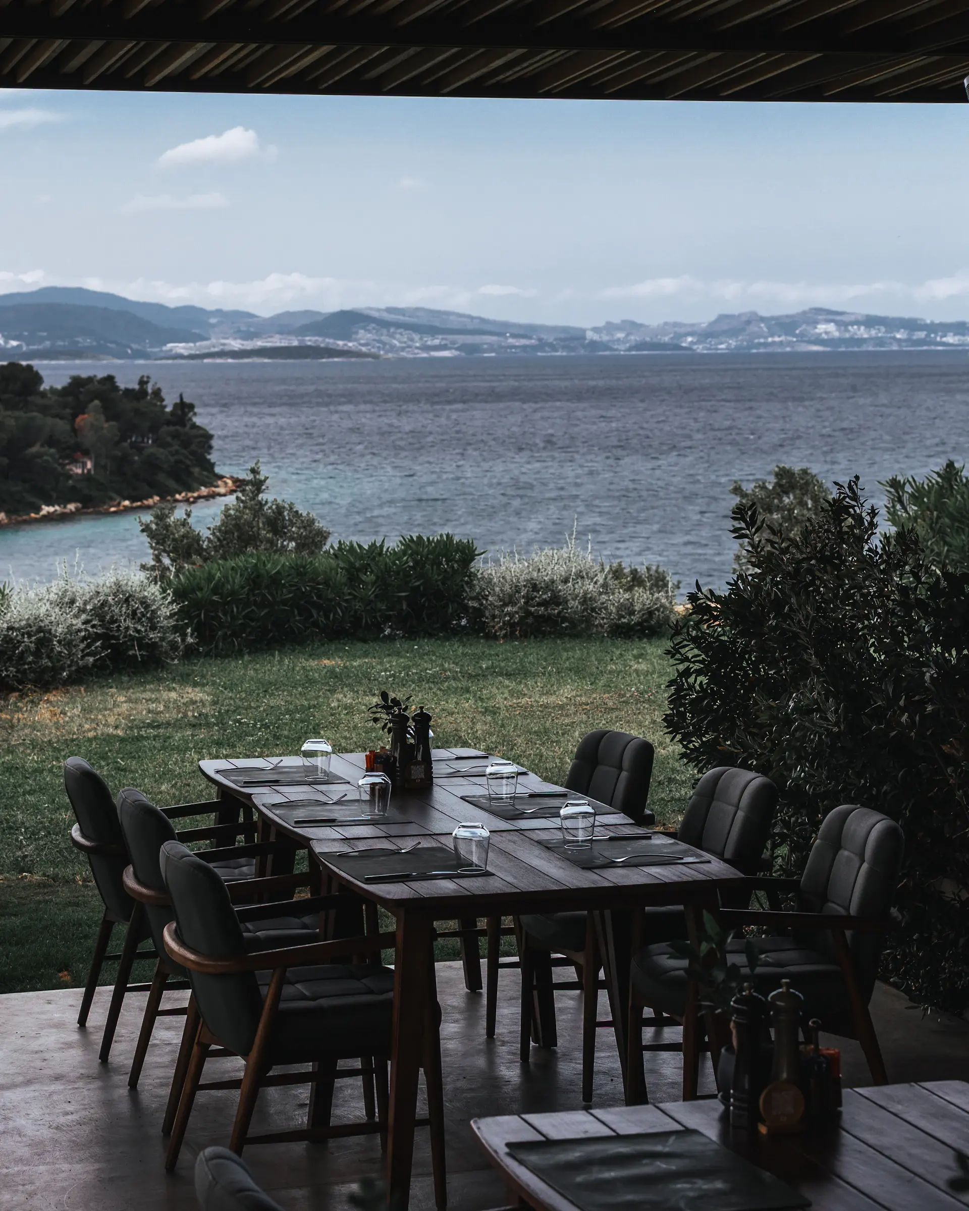 Candlelit table set on an open coastline
