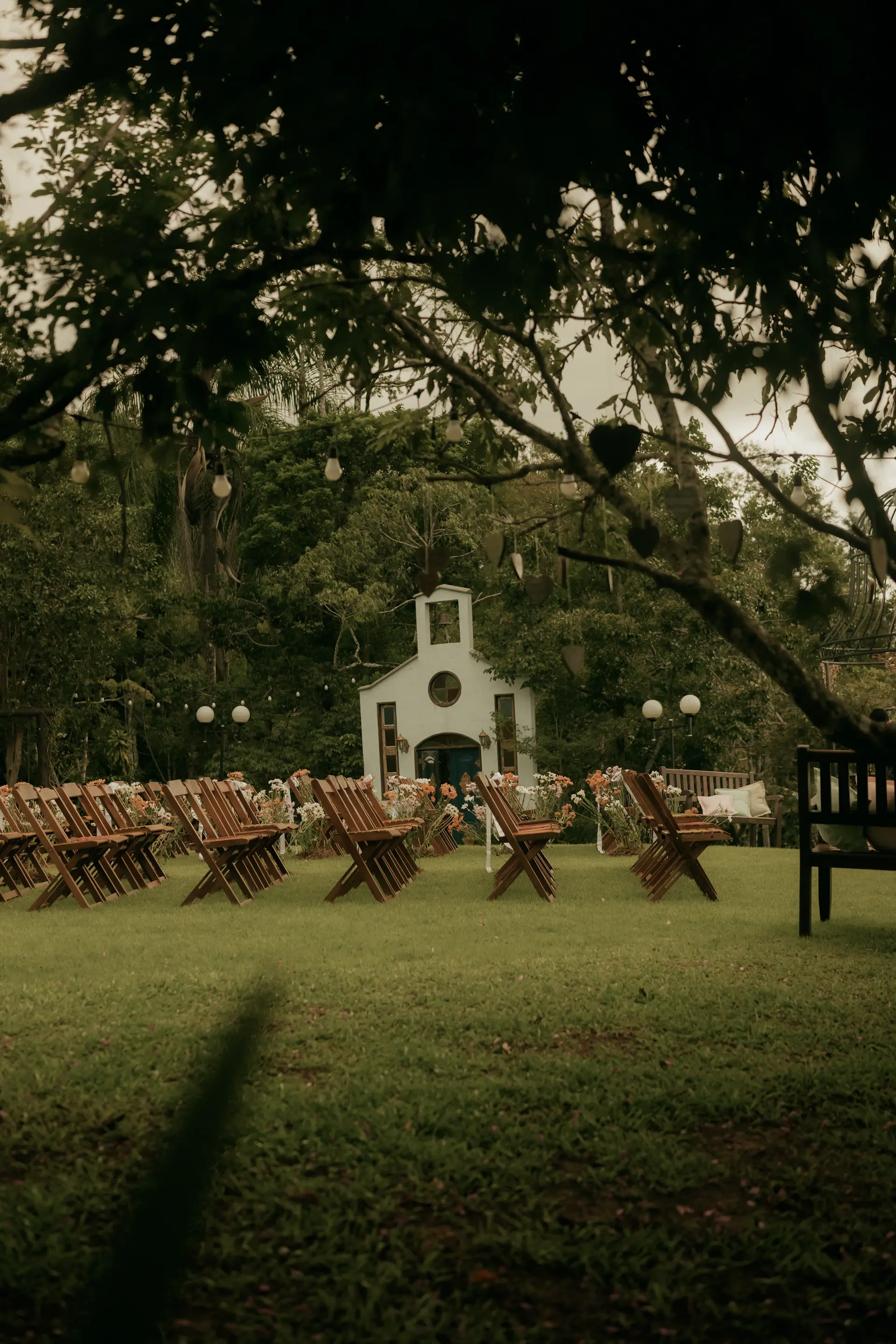 A light-filled chapel hall set for an intimate ceremony