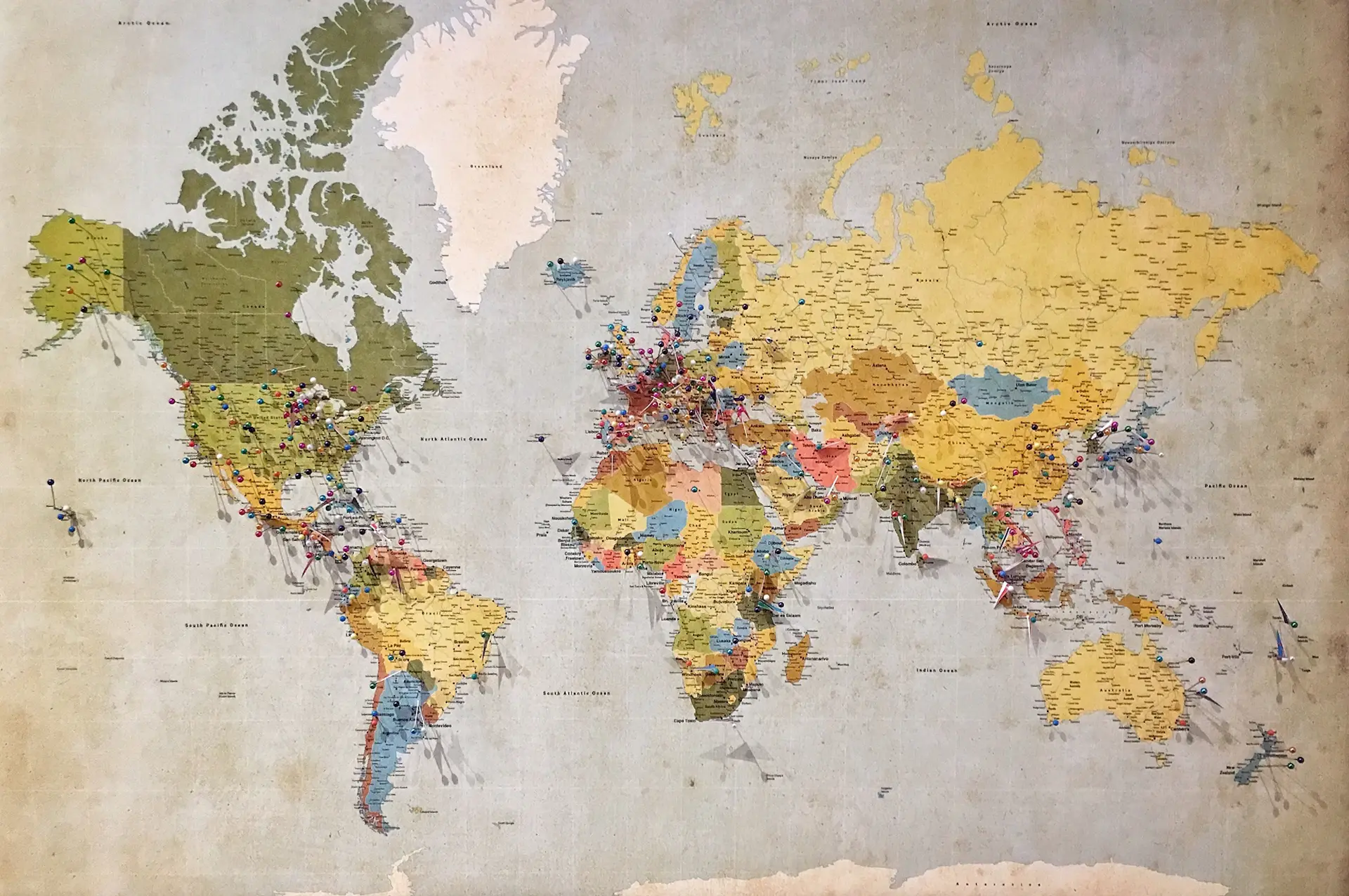 Stylized muted world map marking the house's destinations