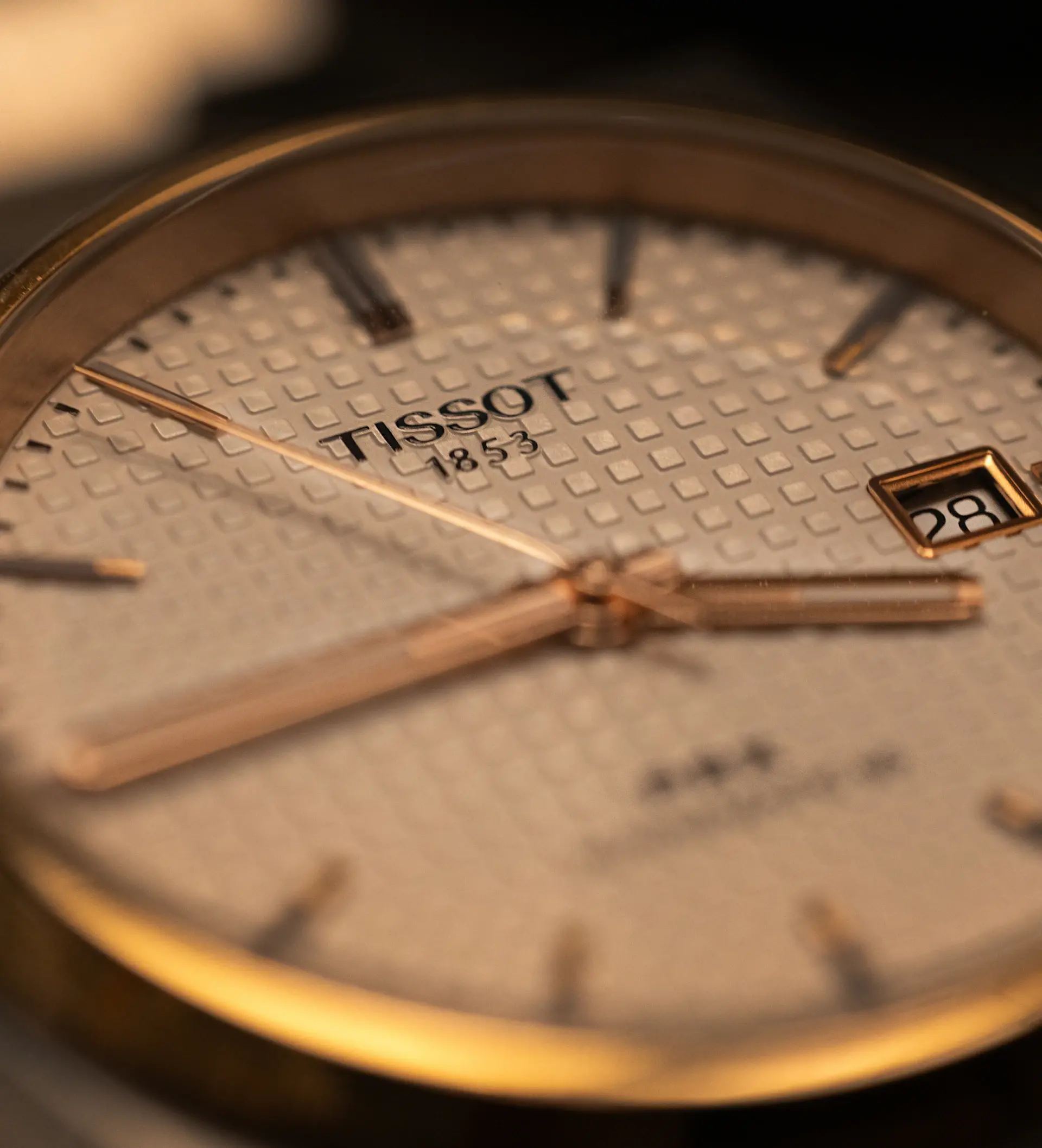 Close-up of analogue instrument dial with gold indices