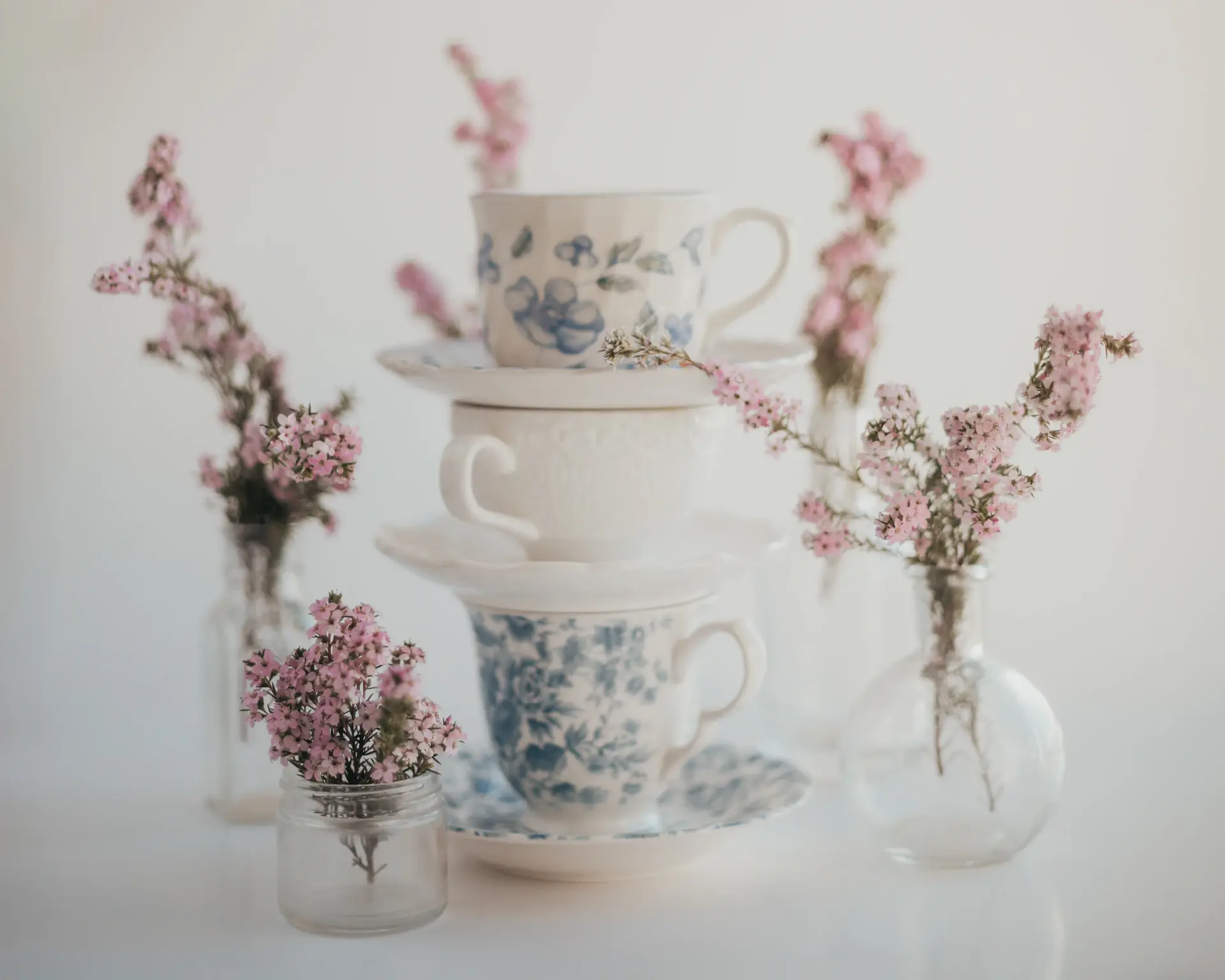 Spring florals beside a coffee cup on a cafe table