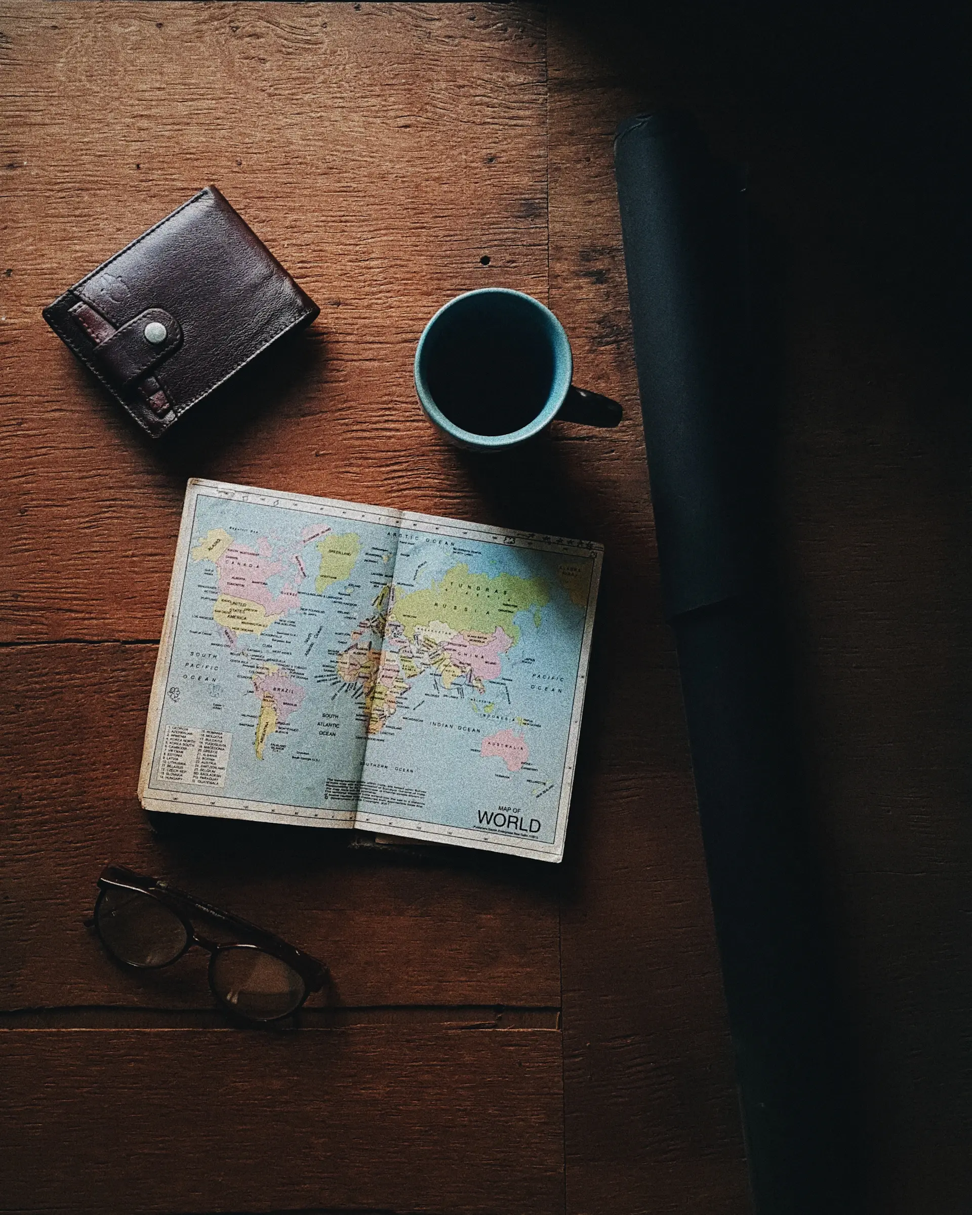 A Veylune curator planning a bespoke expedition by hand