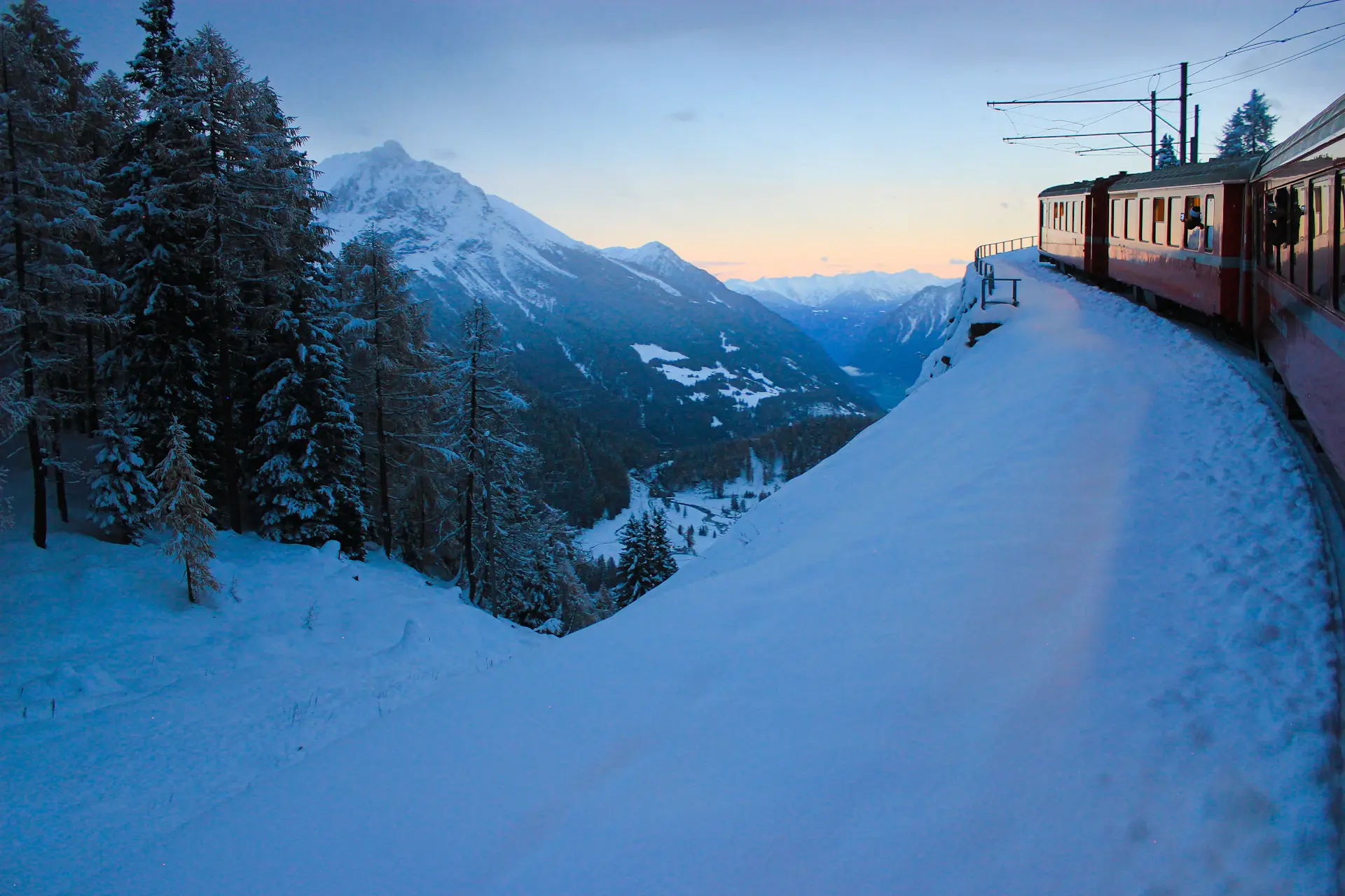 Alpine chalet estate beneath snow peaks