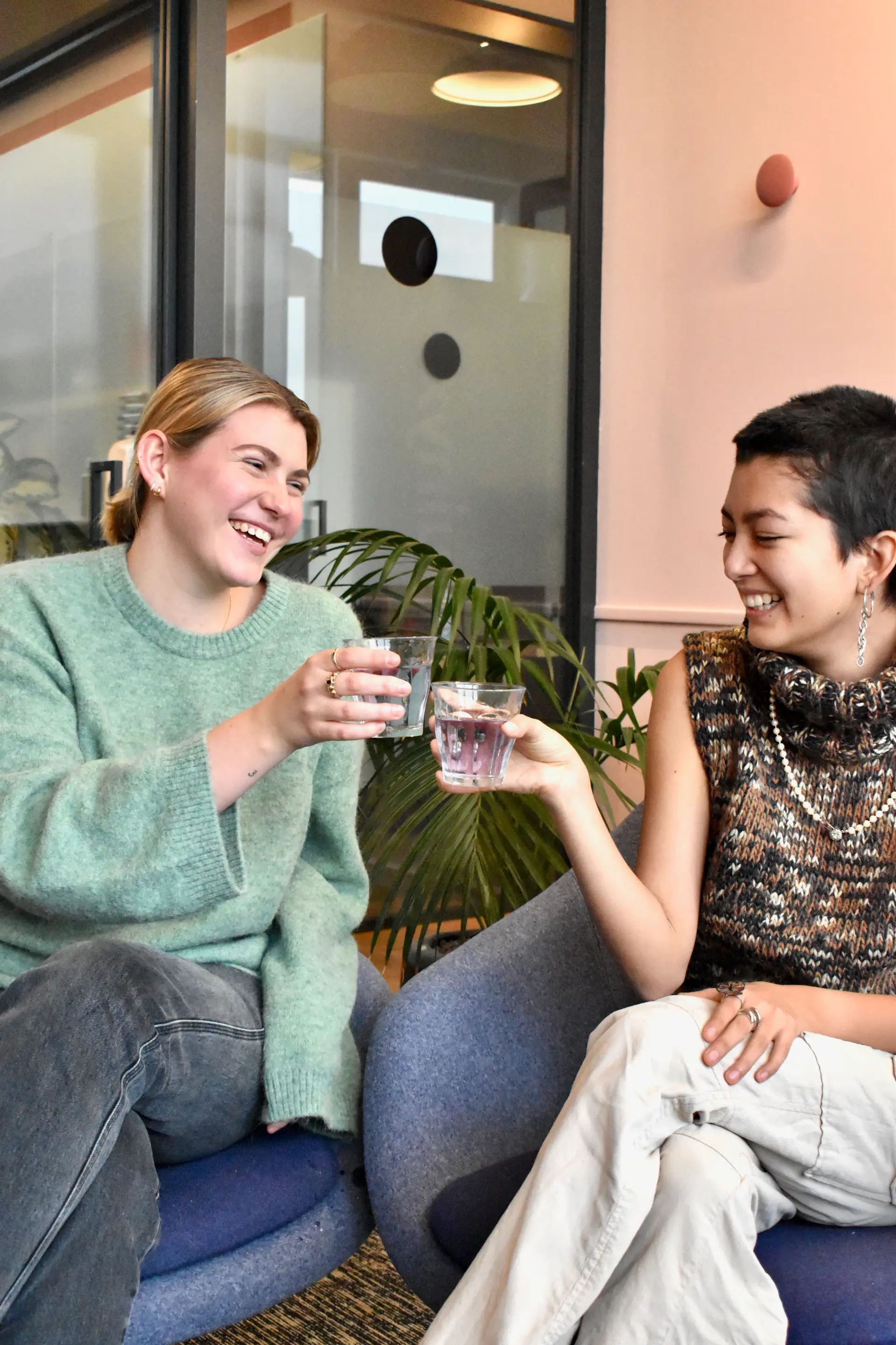 Team laughing together during a coffee break