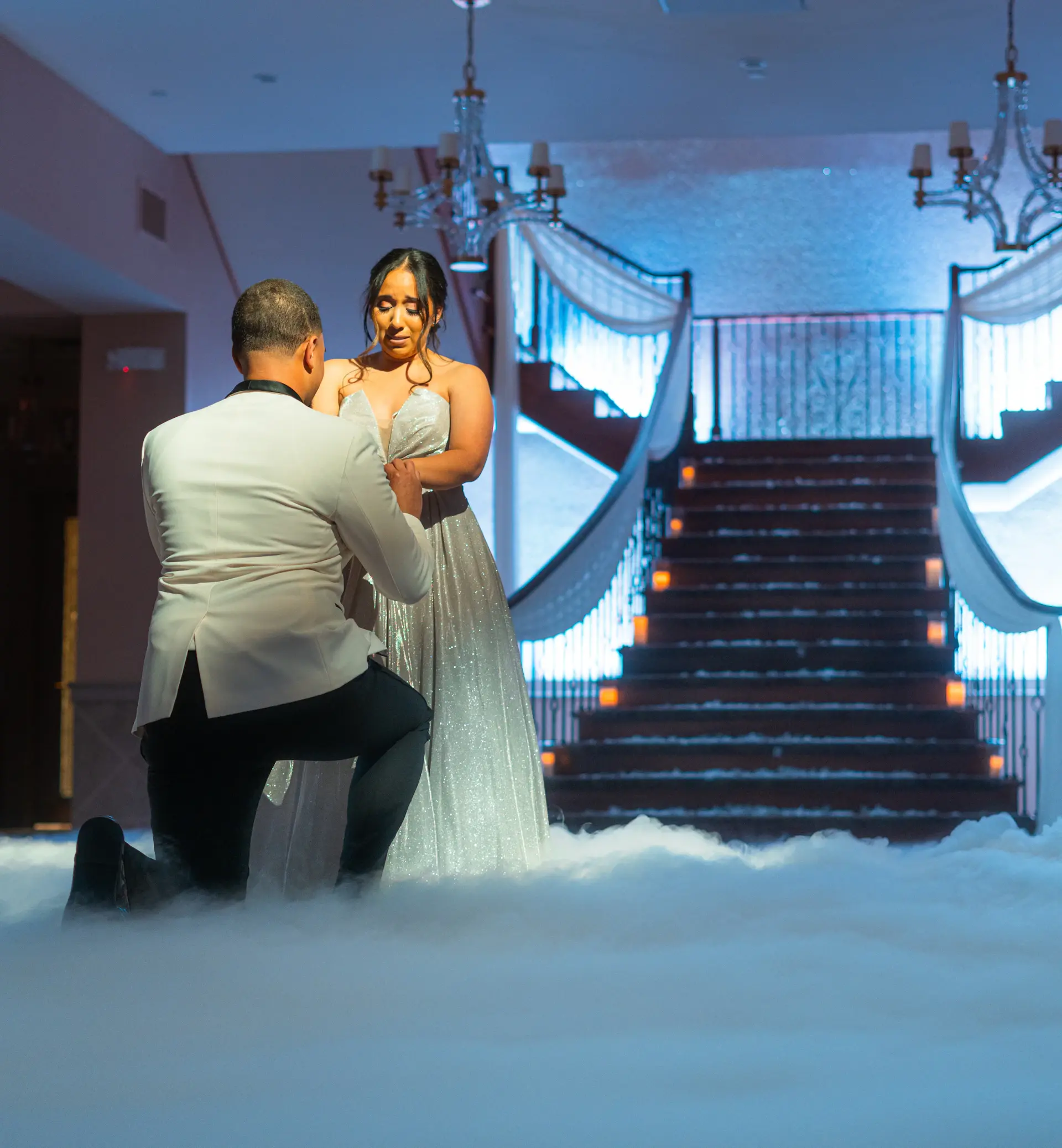A candlelit wedding aisle lined with hundreds of tapers