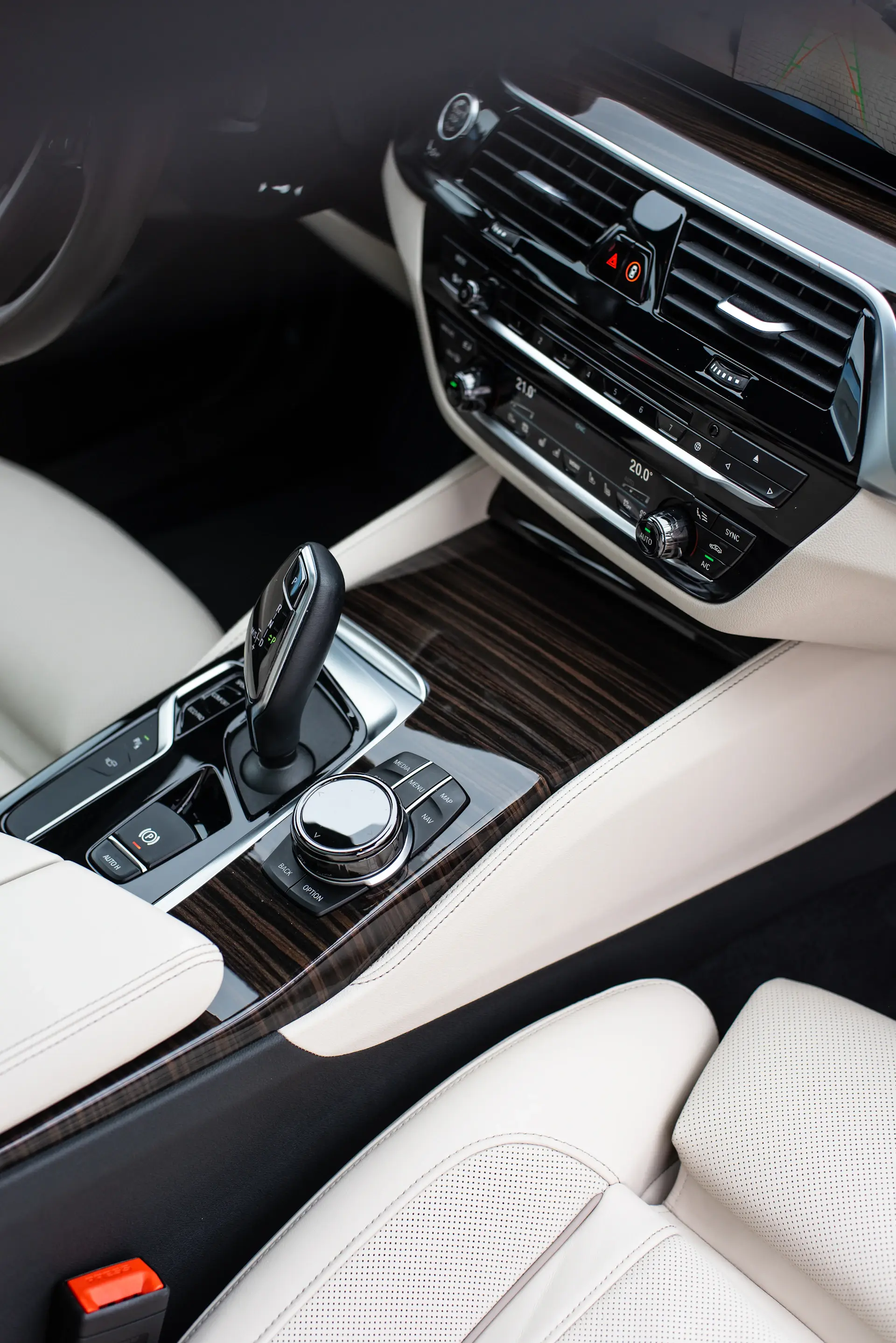 Artisan inlaying fine wood veneer in a car interior