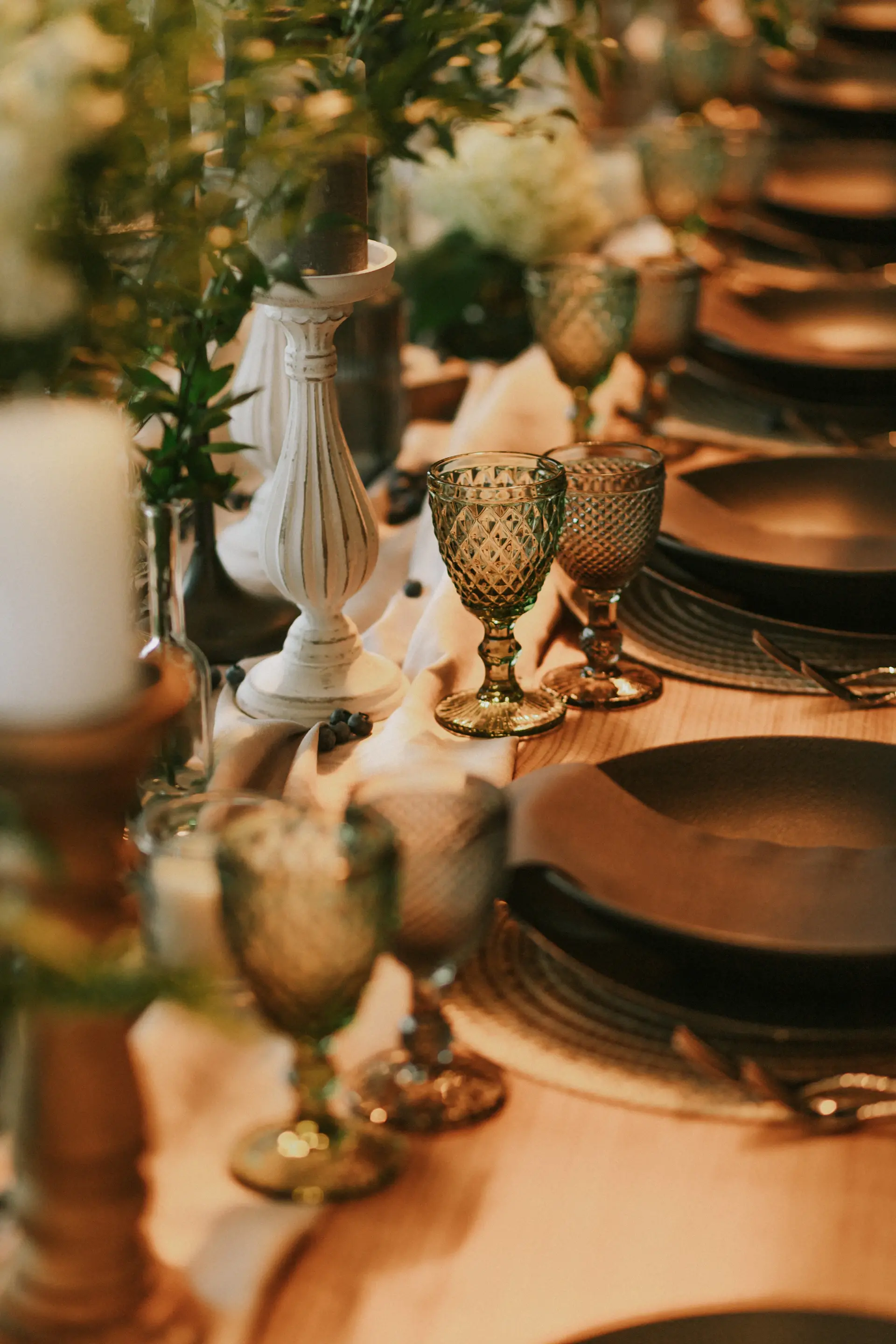 An elegant wedding tablescape with gold accents and candlelight