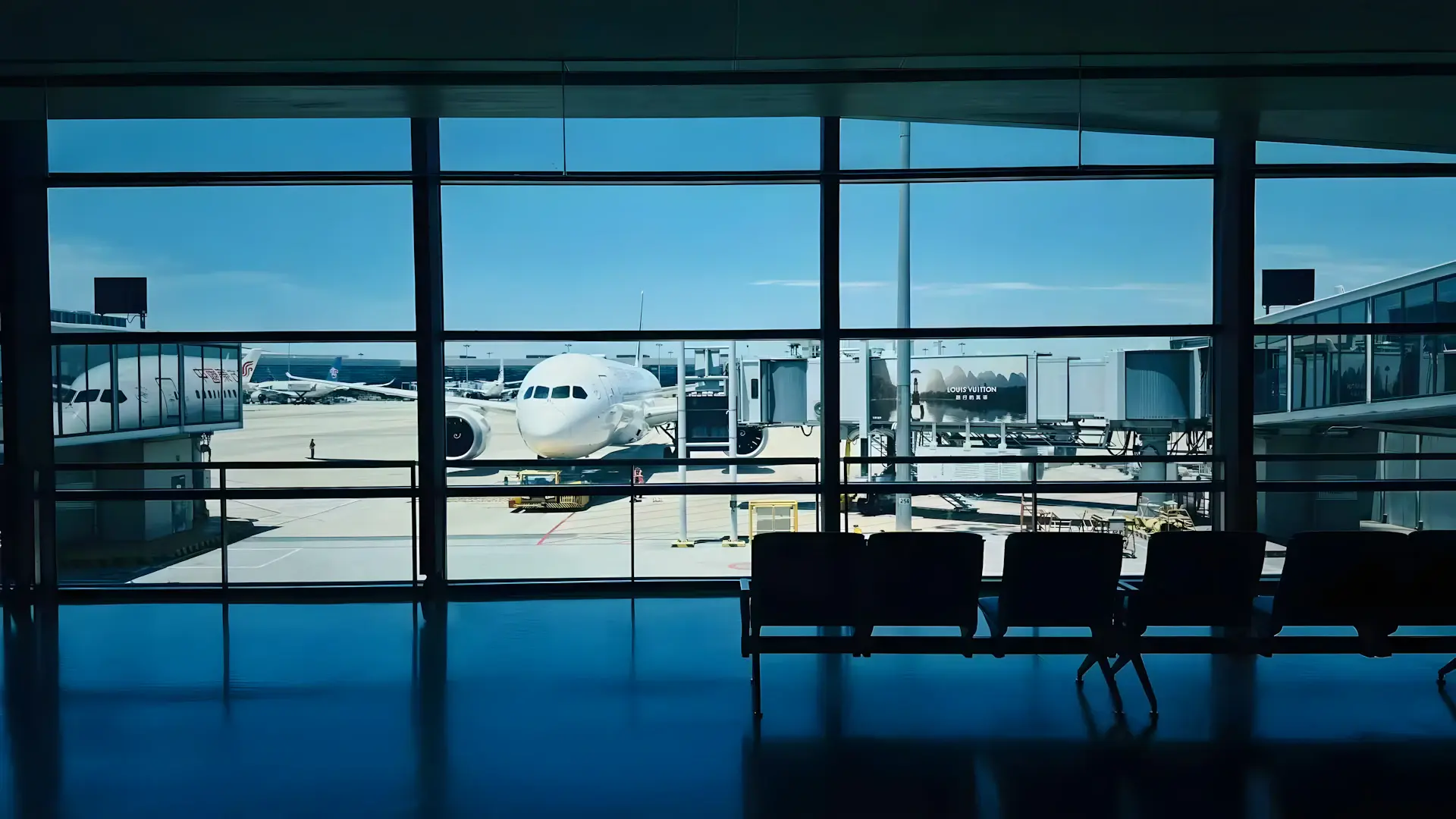 Cinematic view of an airport departure gate at golden hour