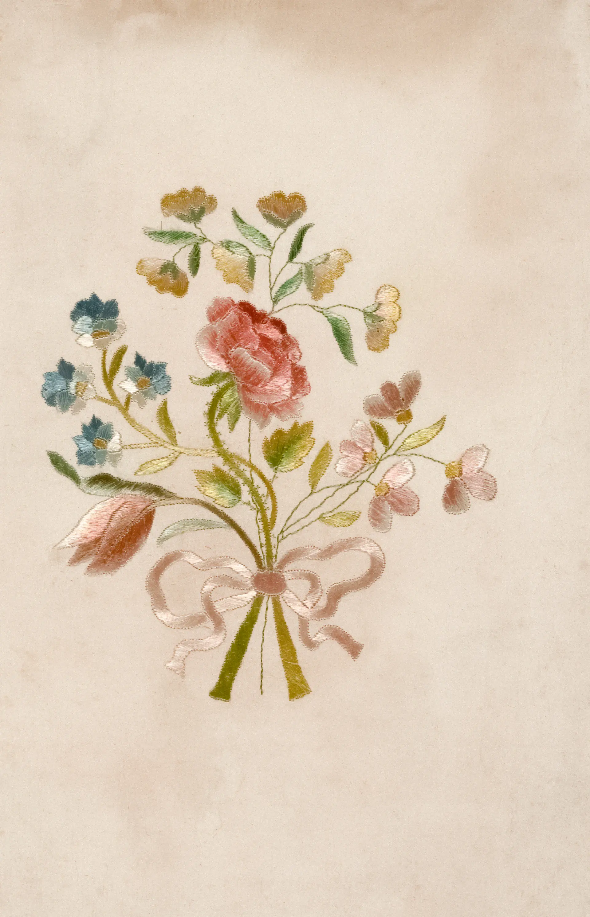 Close-up of a Maison Rose handwritten note and silk ribbon