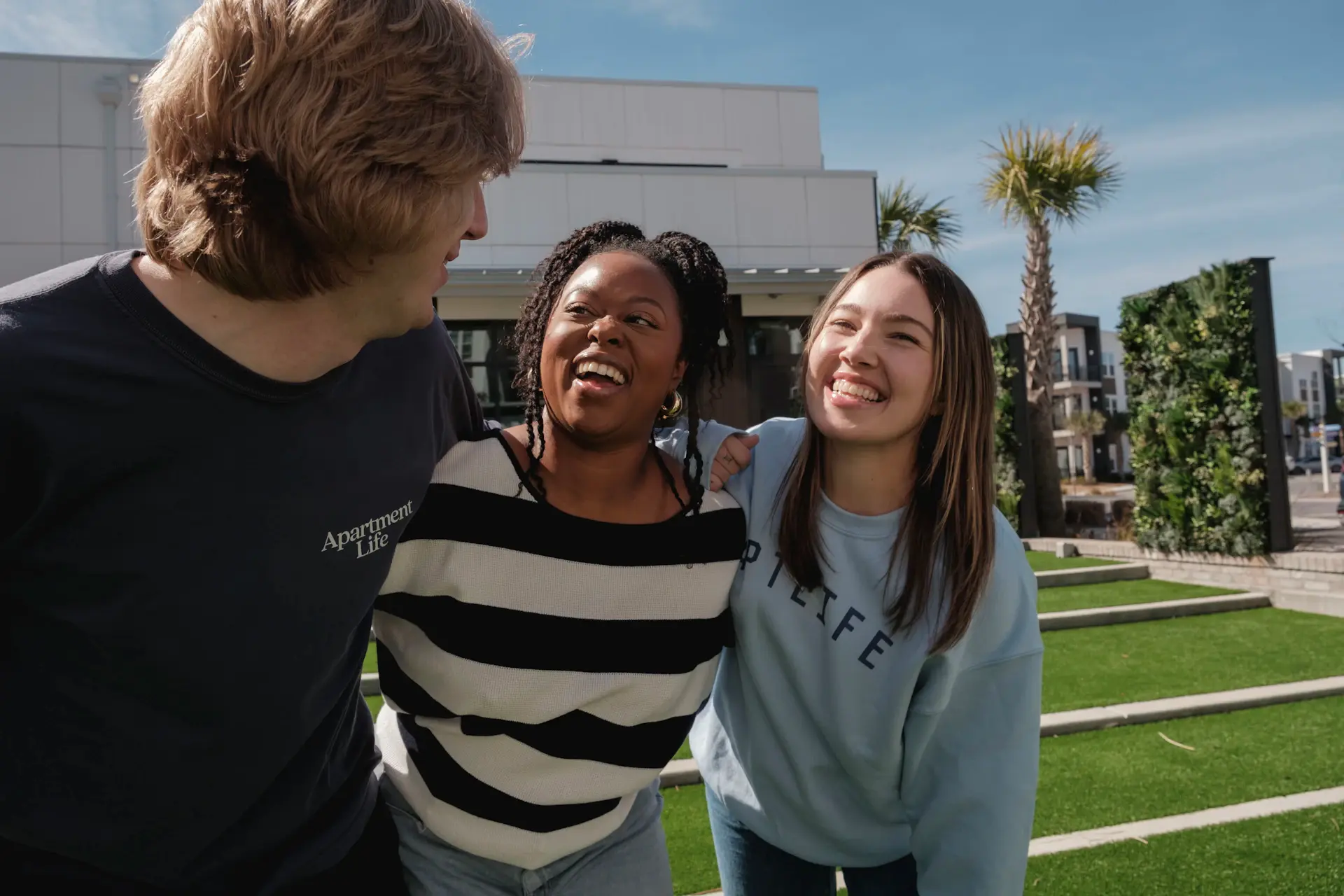 Group of international students laughing together outdoors