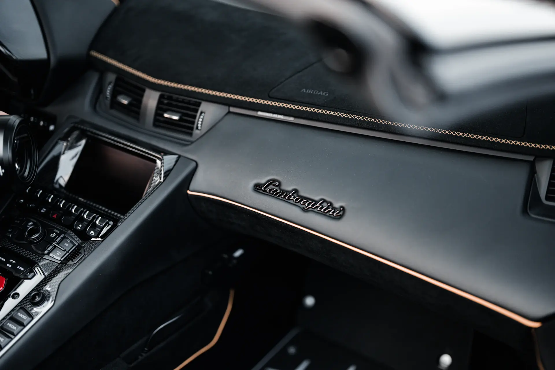 Bespoke two-tone interior with contrast stitching and burr walnut veneer