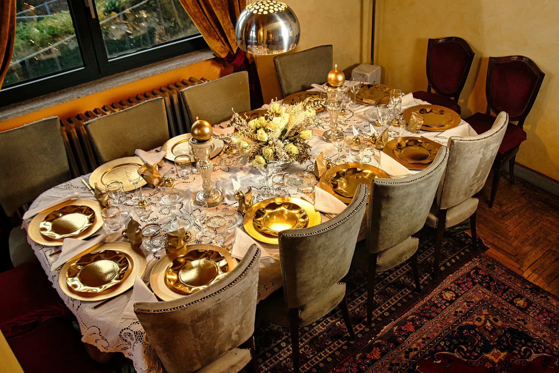 Long banquet table dressed in ivory and gold