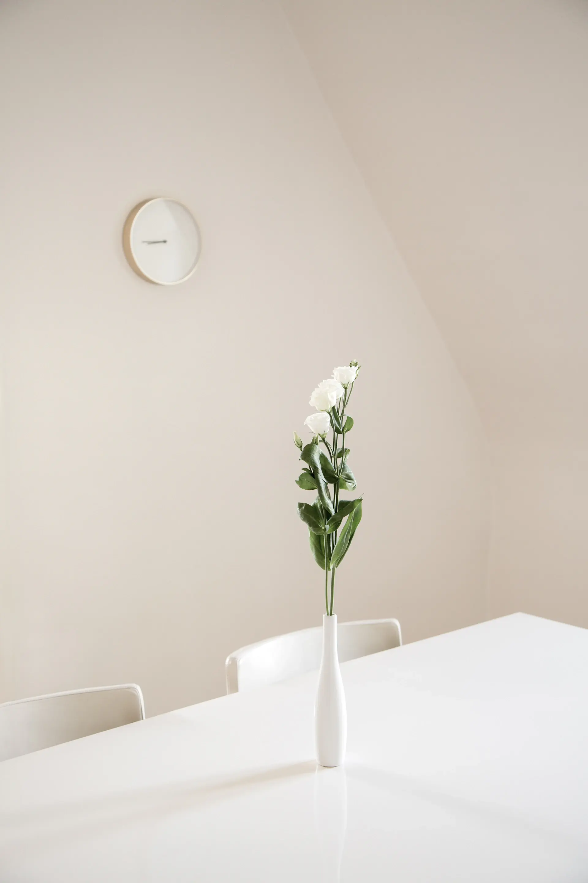 Bridal bouquet of pale roses held against white