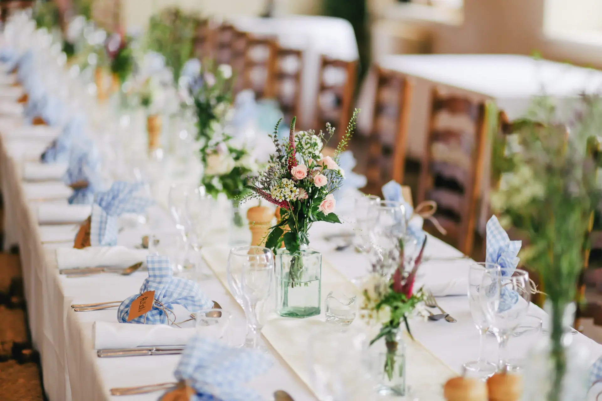 Ivory and pearl table setting with delicate linens