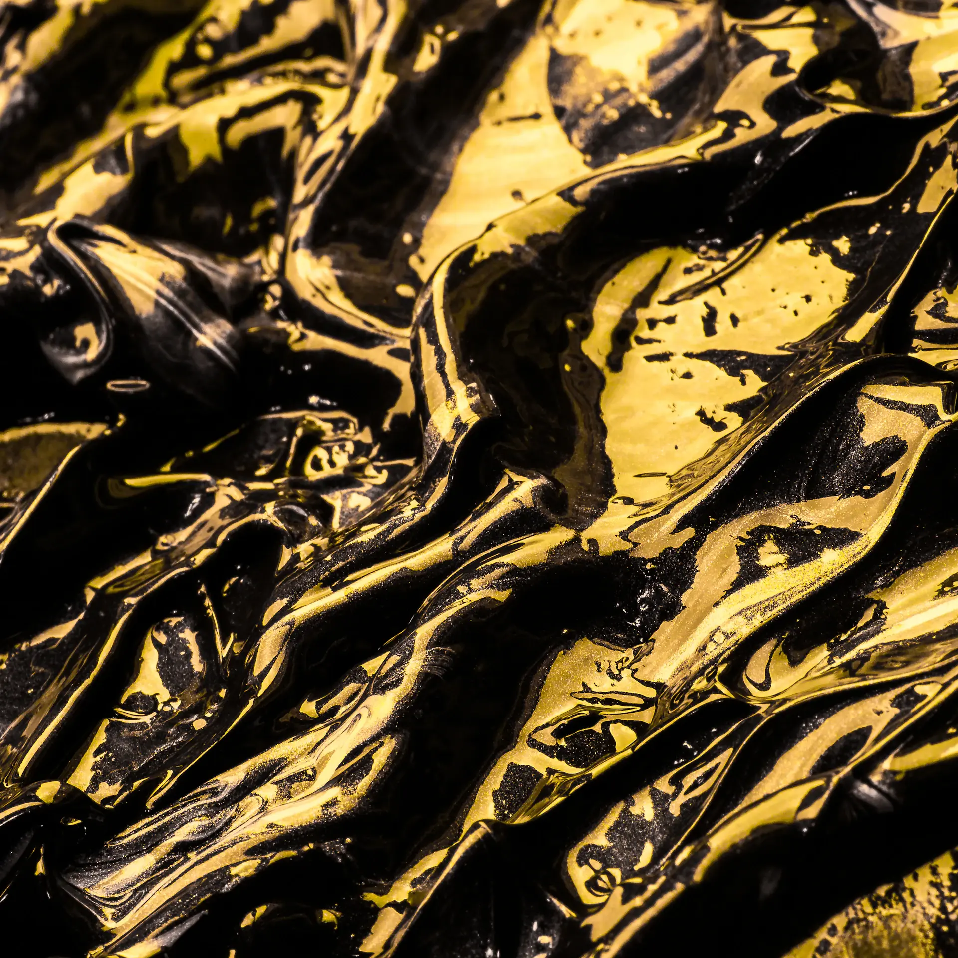 Close-up of gold foil embossing on a black presentation box