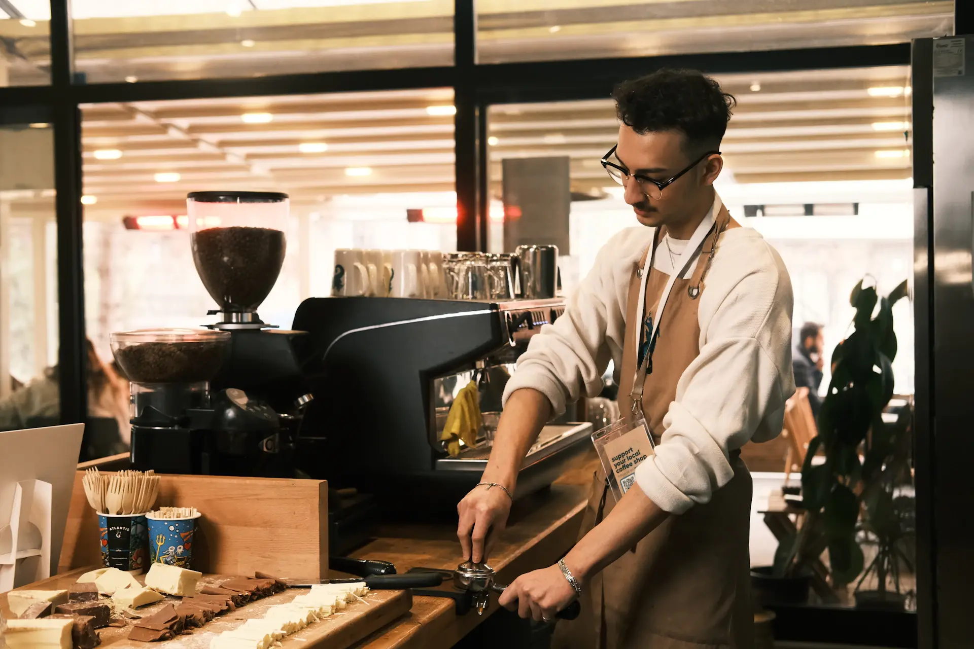 International student working a part-time job in a stylish café