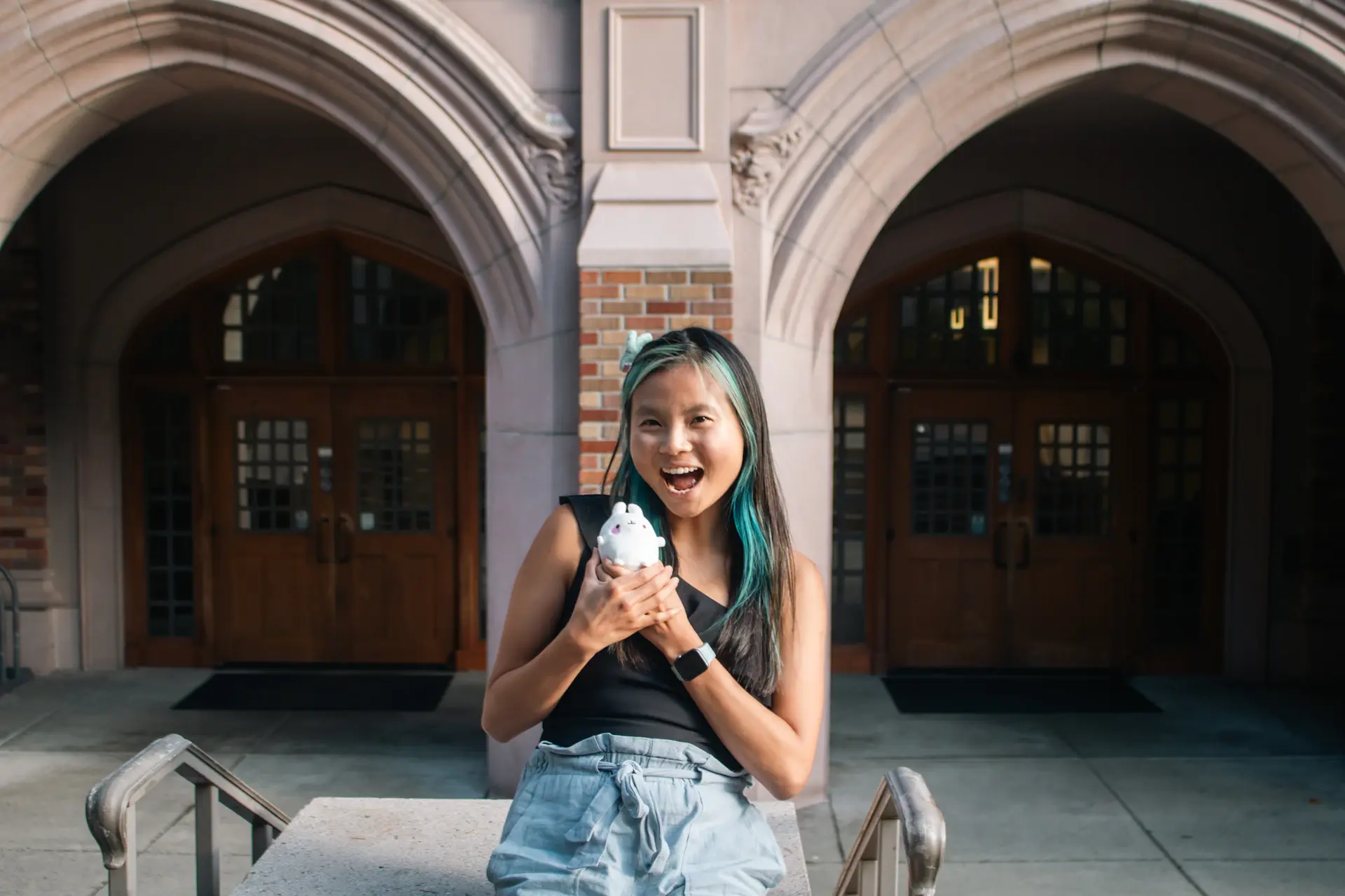 Young woman smiling on a university campus