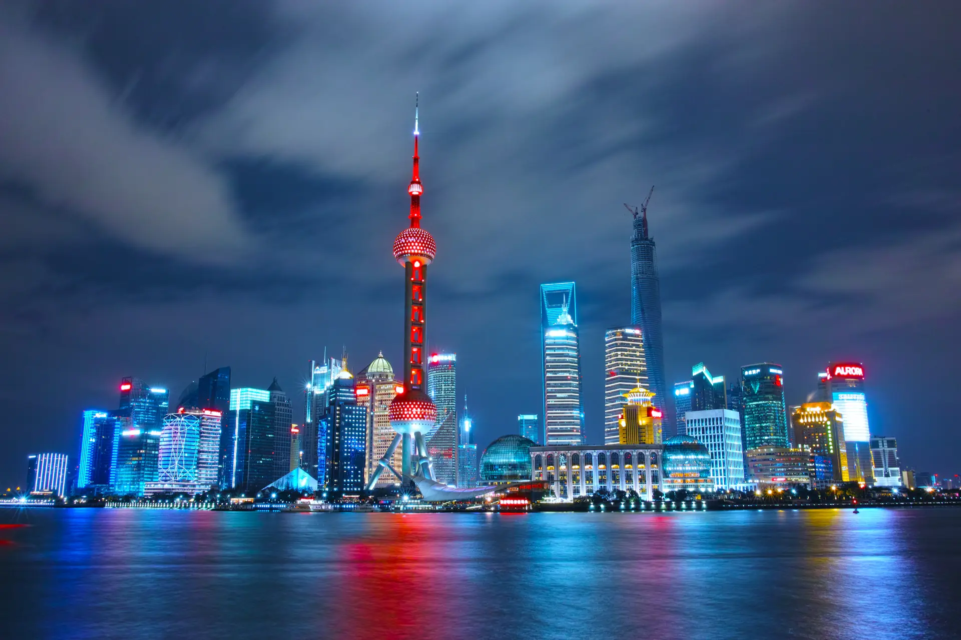 Shanghai Pudong skyline lit up over the Huangpu River at night