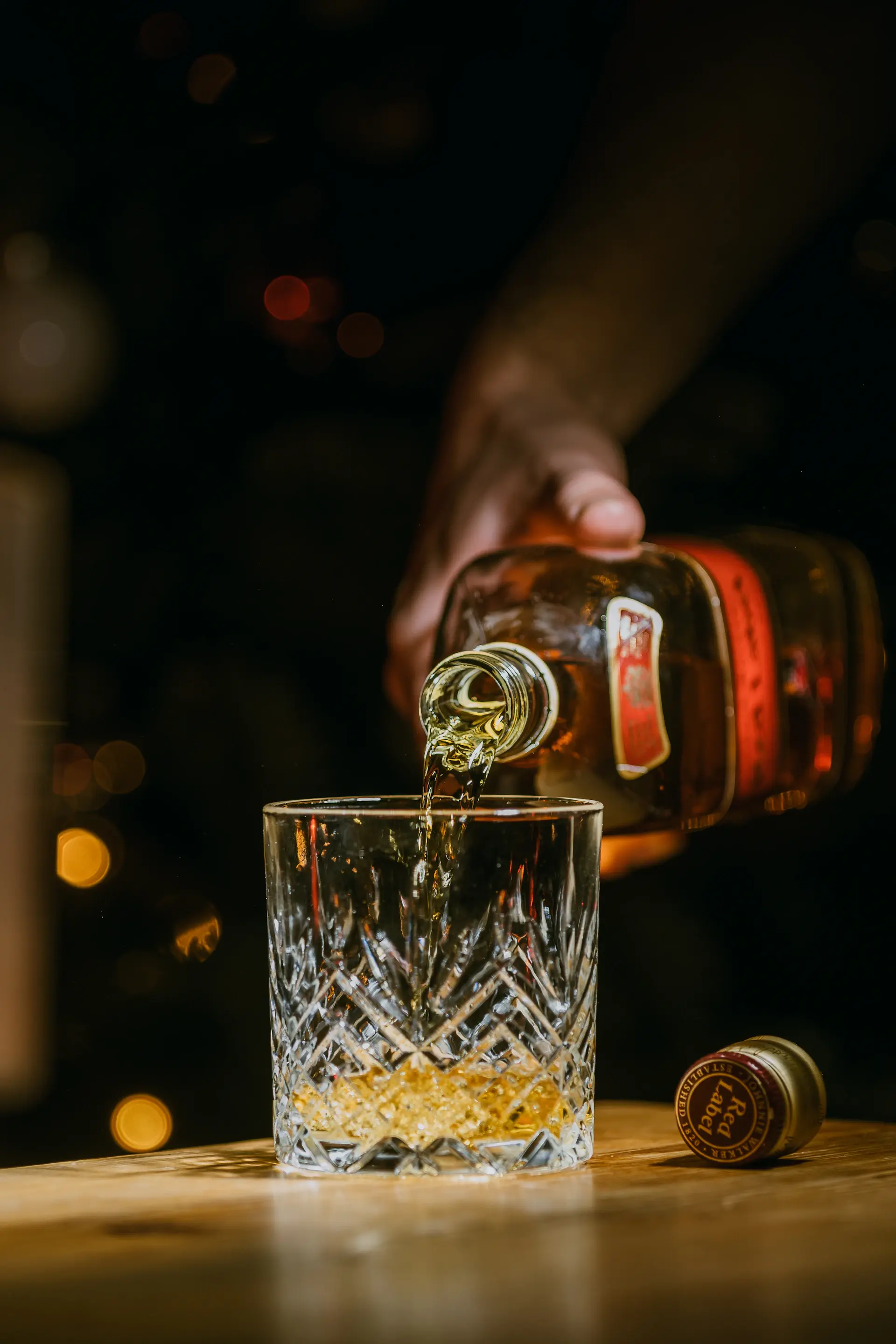 Amber whisky poured into a crystal nosing glass