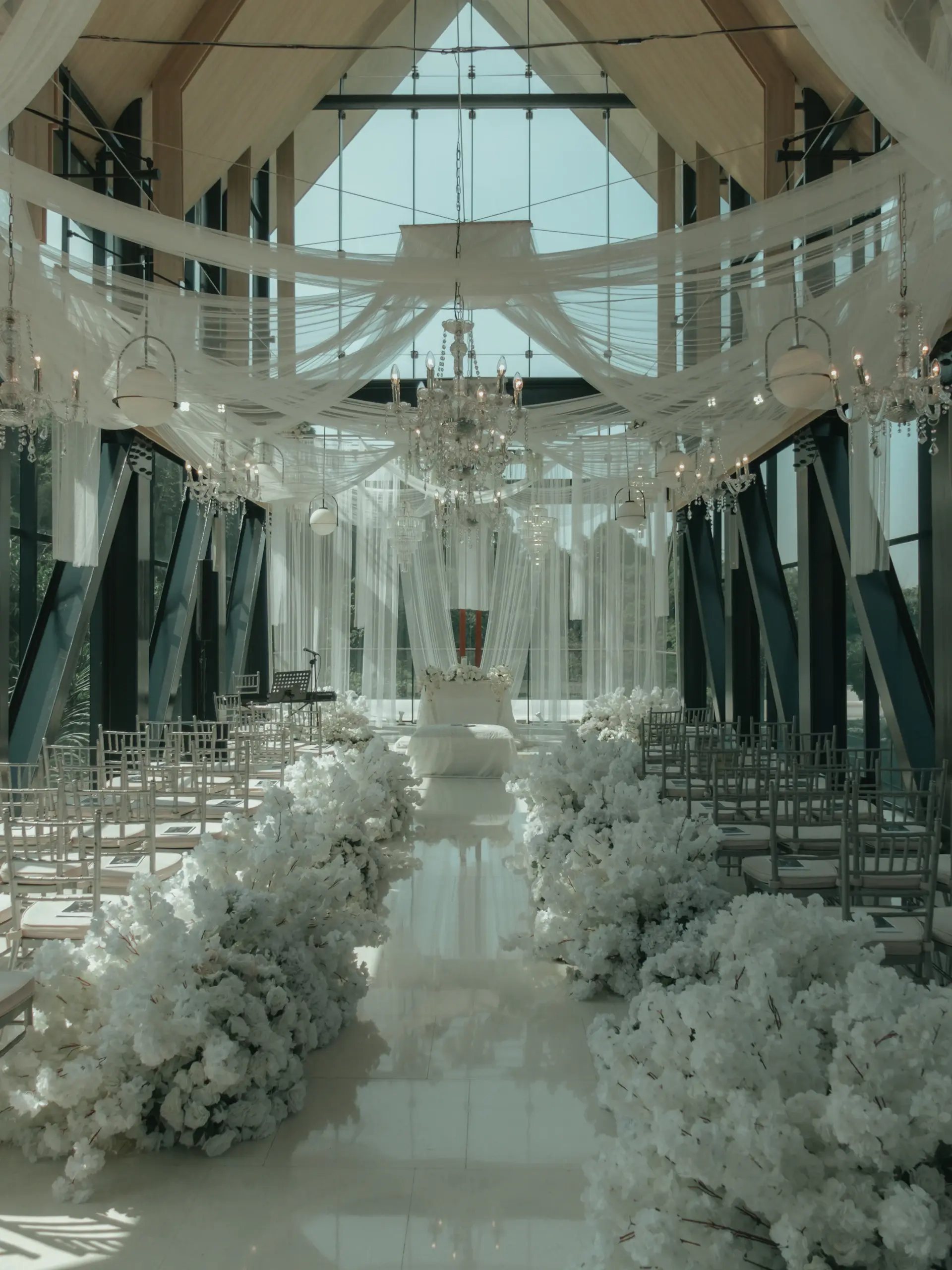 An elegant ceremony aisle dressed in ivory and champagne tones