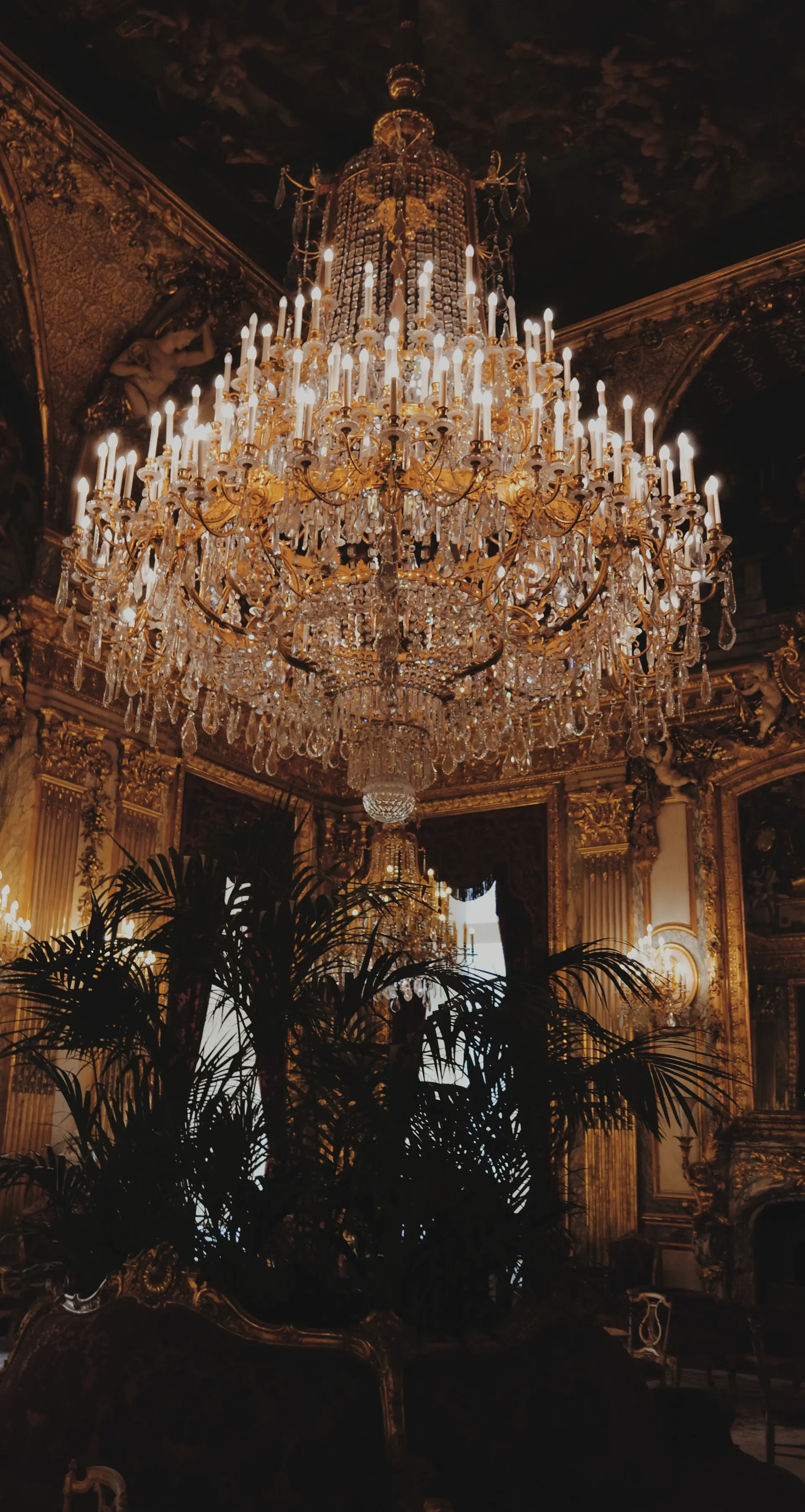 Candlelit reception under crystal chandeliers