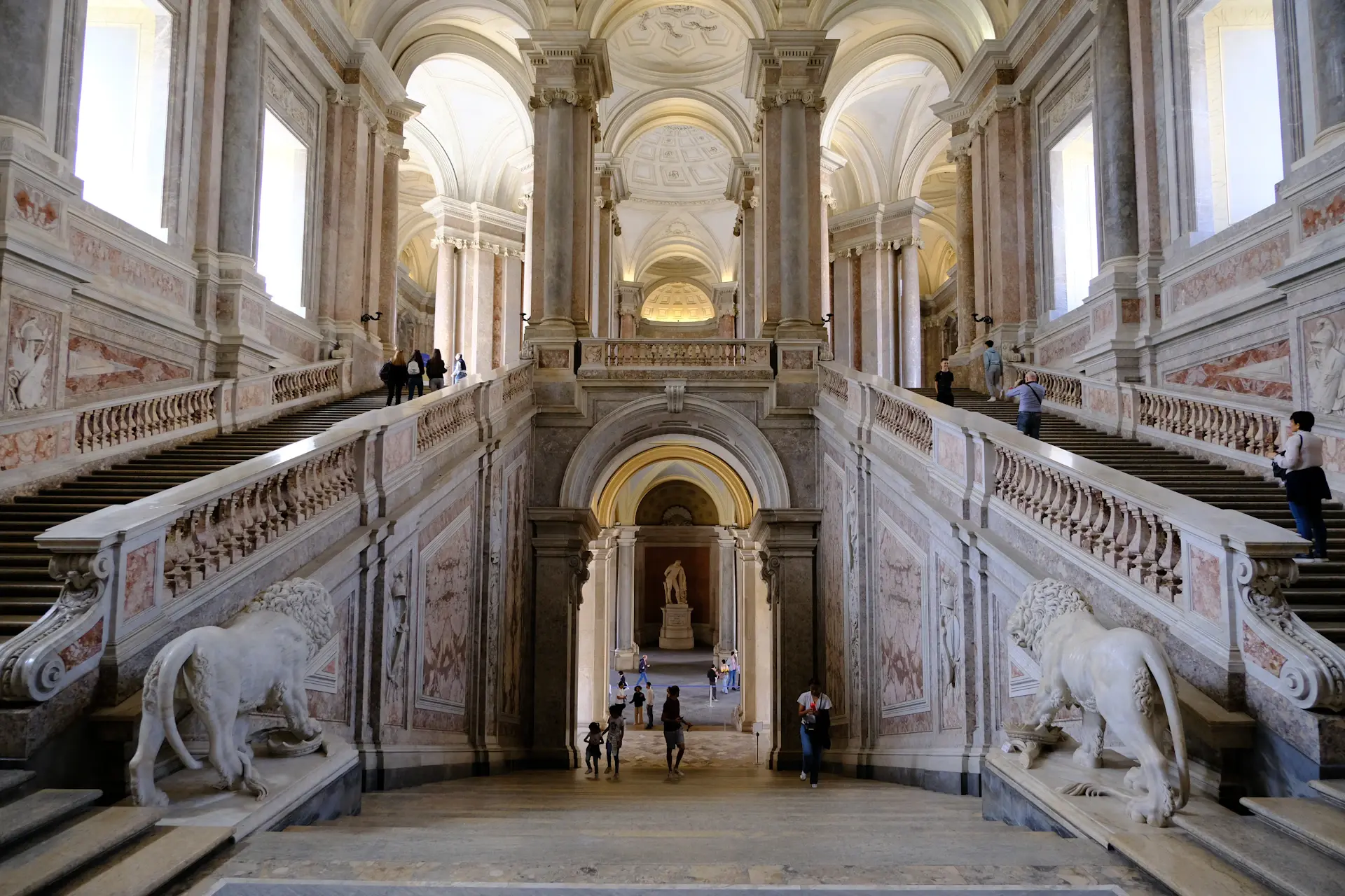 Ornate palace staircase with golden light