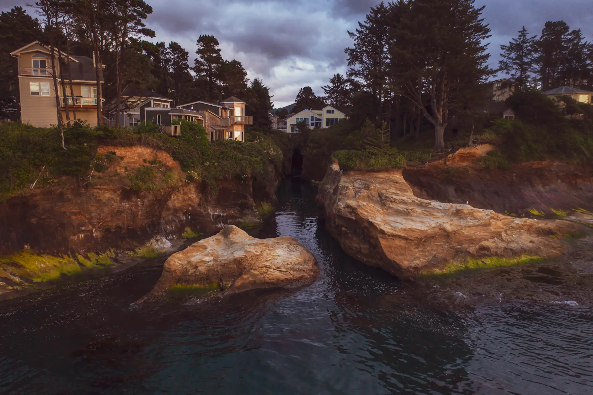 Infinity-pool villa overlooking the coastline at dusk