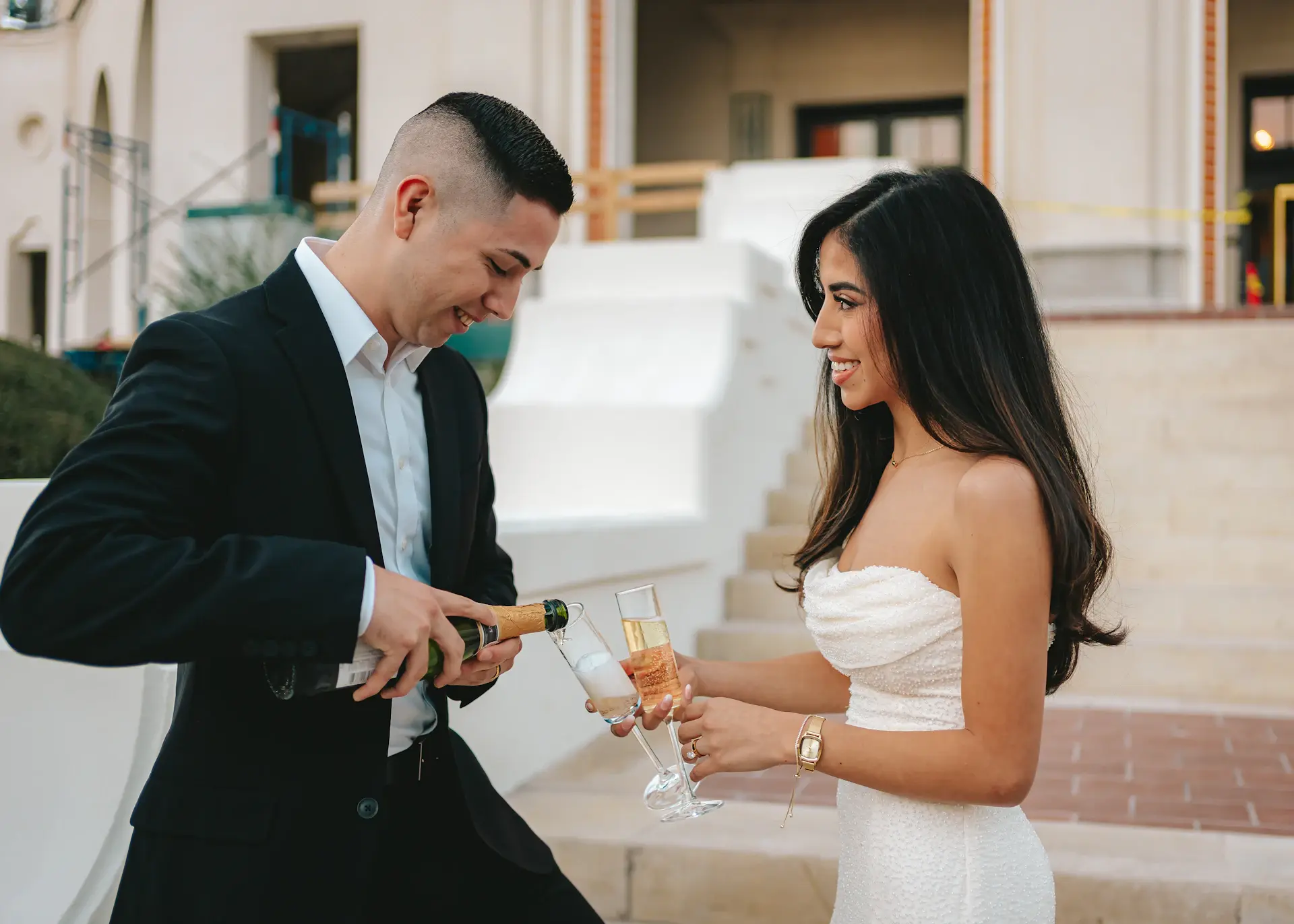 Guests raising champagne glasses at a palace reception