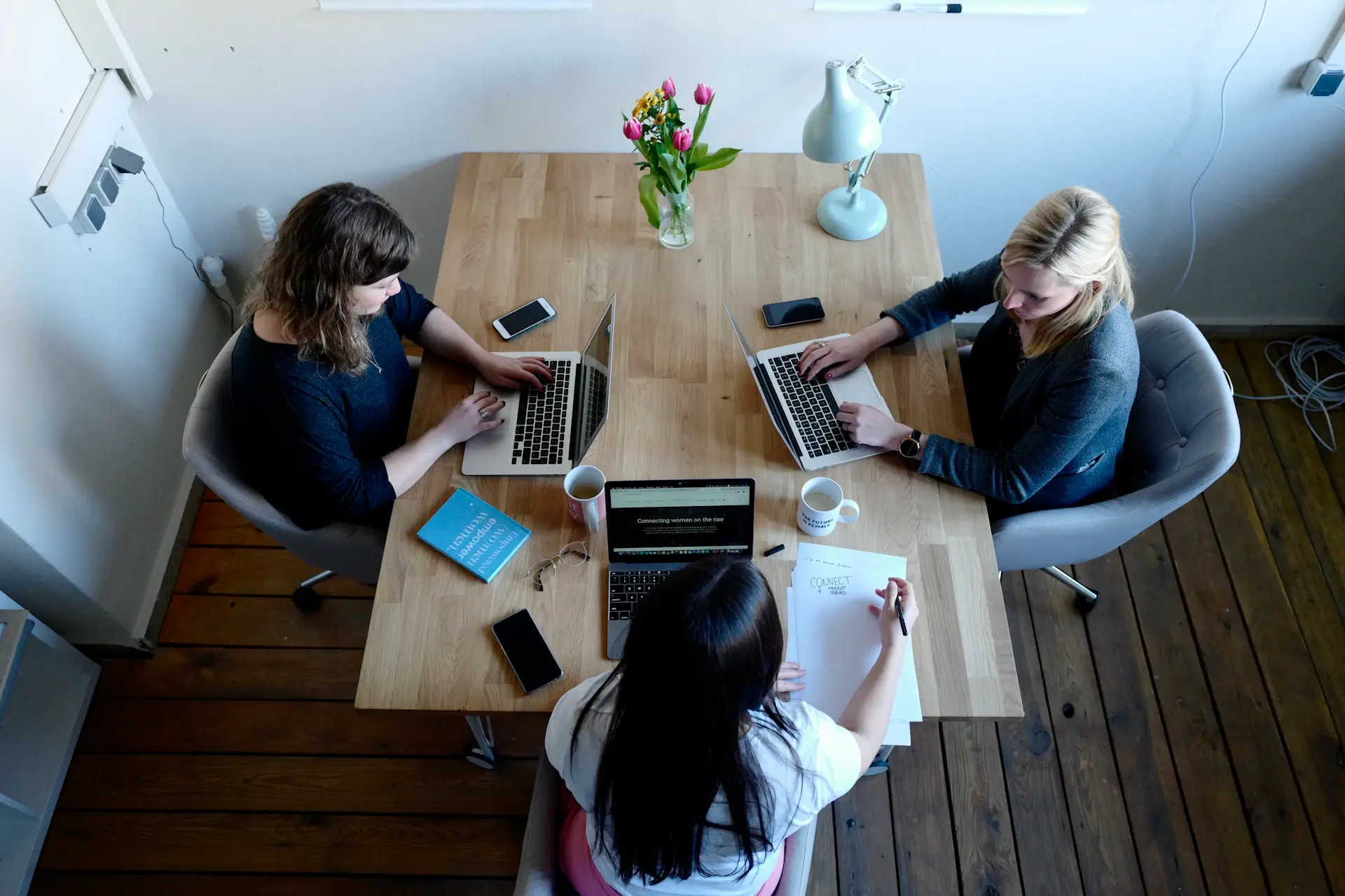 MangoAds team brainstorming around a table