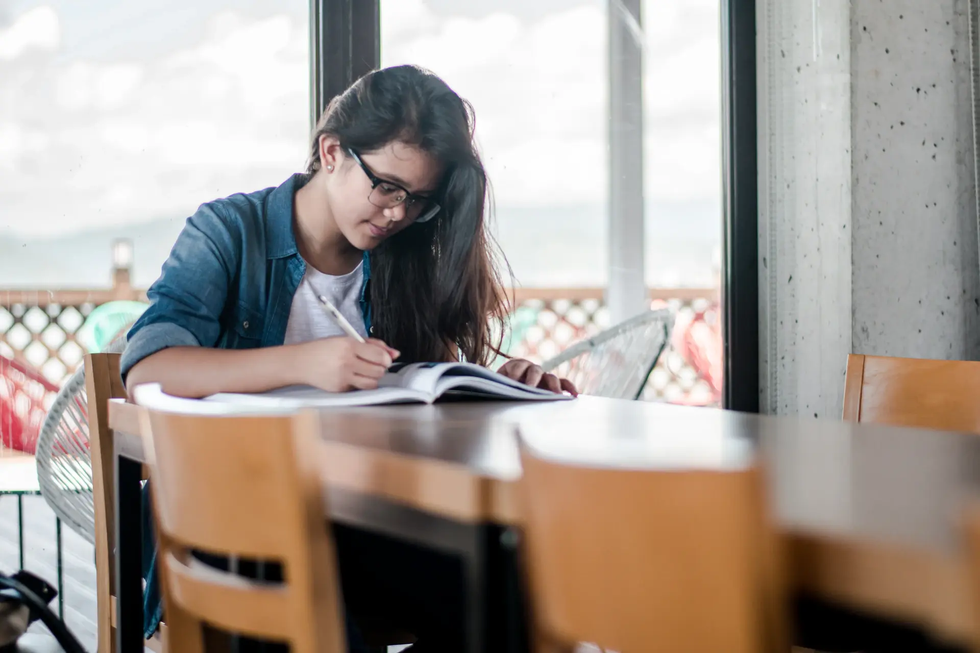 Student preparing a university application at a desk
