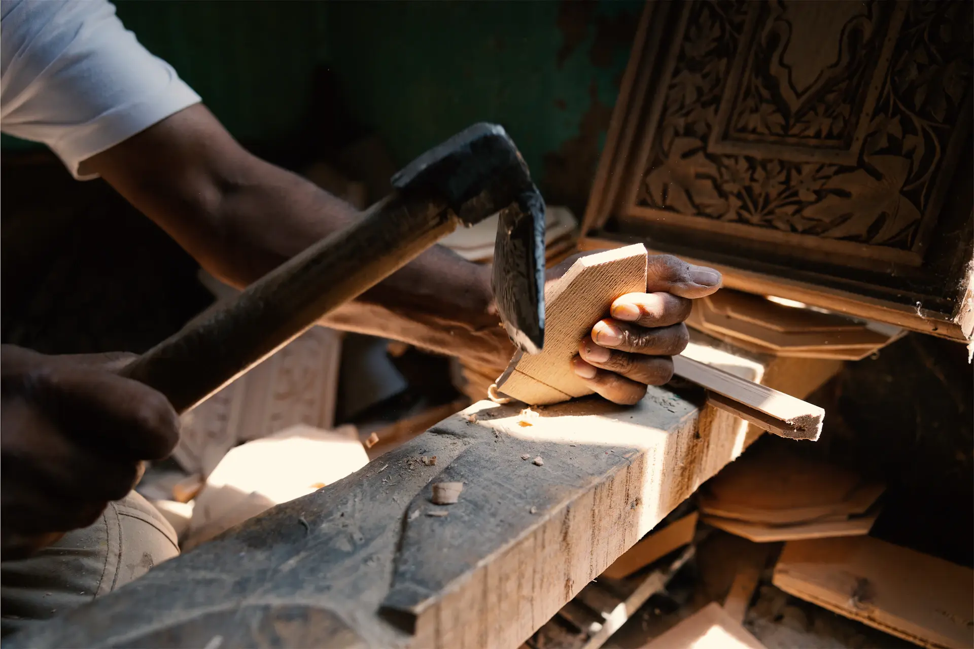 Hands of a craftsman shaping a coachbuilt body panel