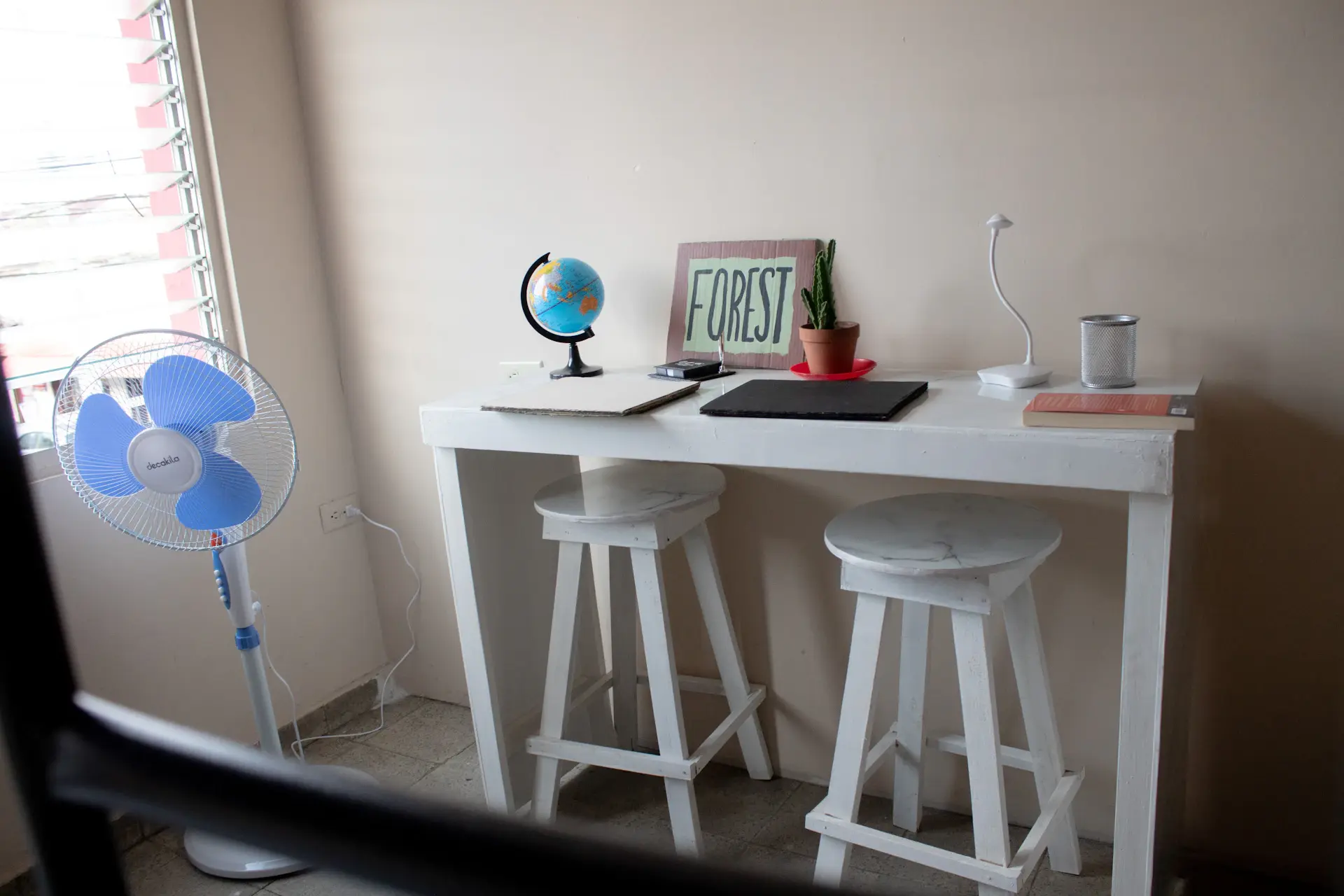 Bright modern university dormitory room with study desk