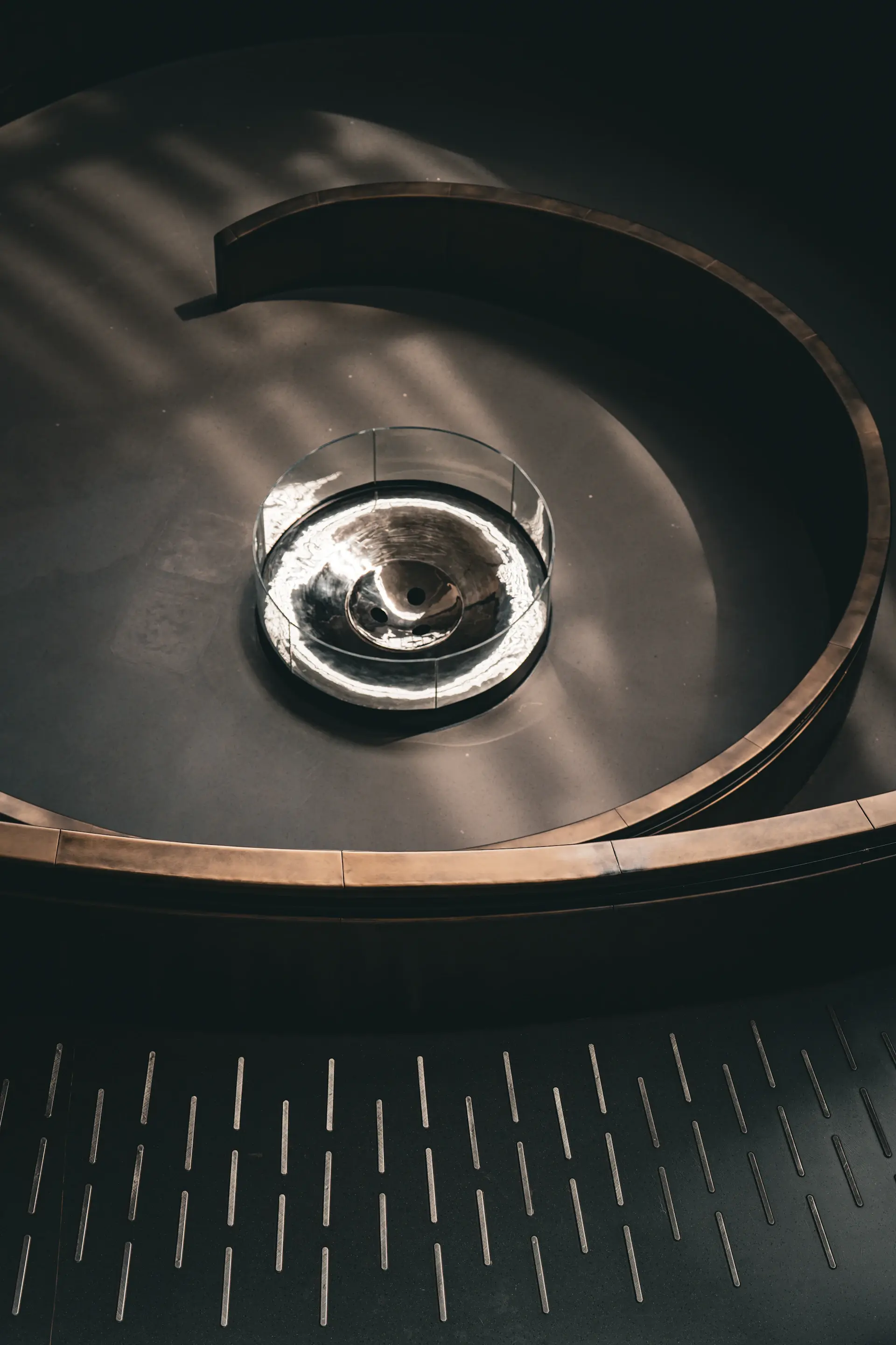 A crystal decanter of aged cognac glowing warmly against a dark ground