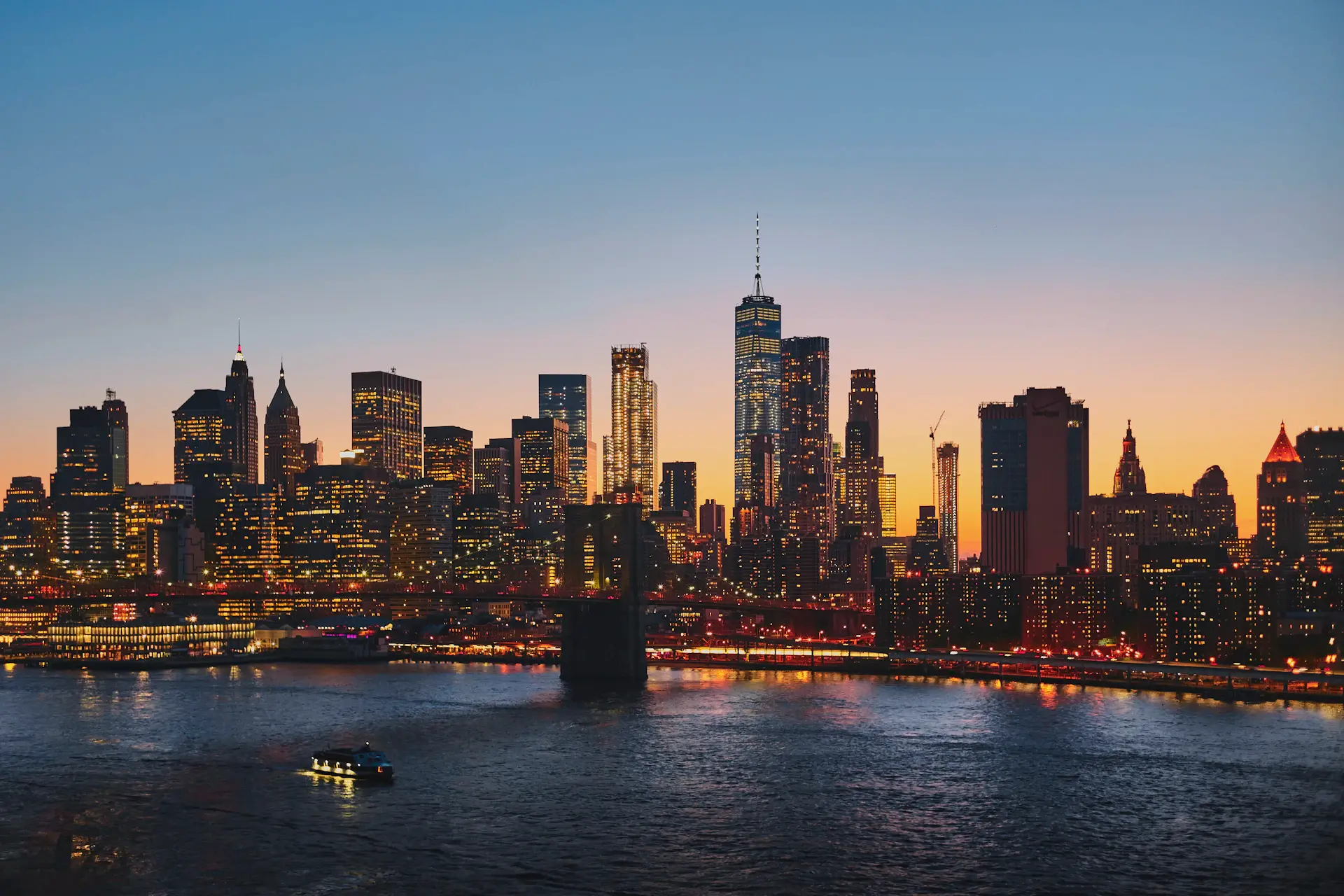 Manhattan skyline at dusk seen from a campus rooftop