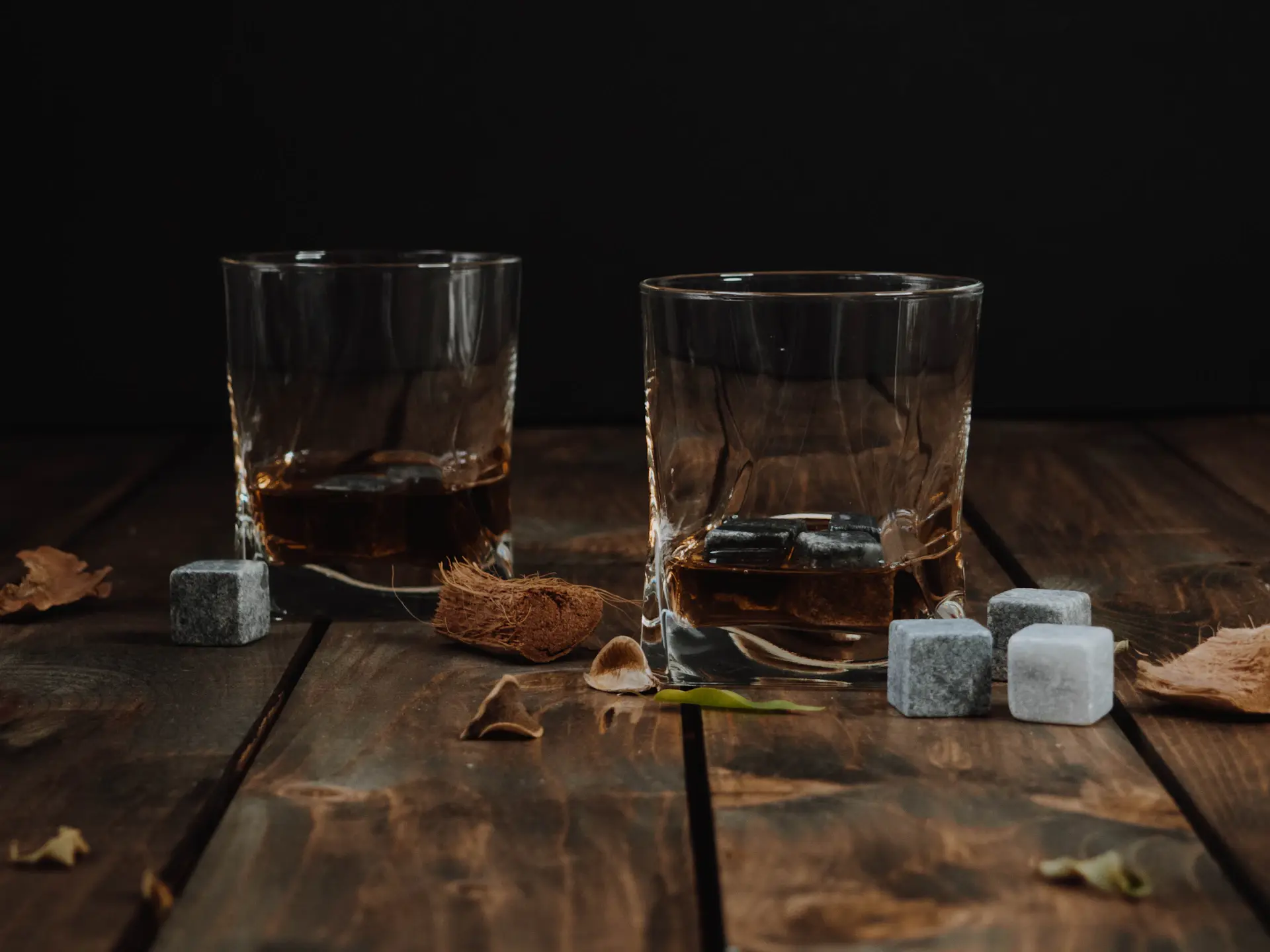 An empty crystal glass catching warm light after a fine pour