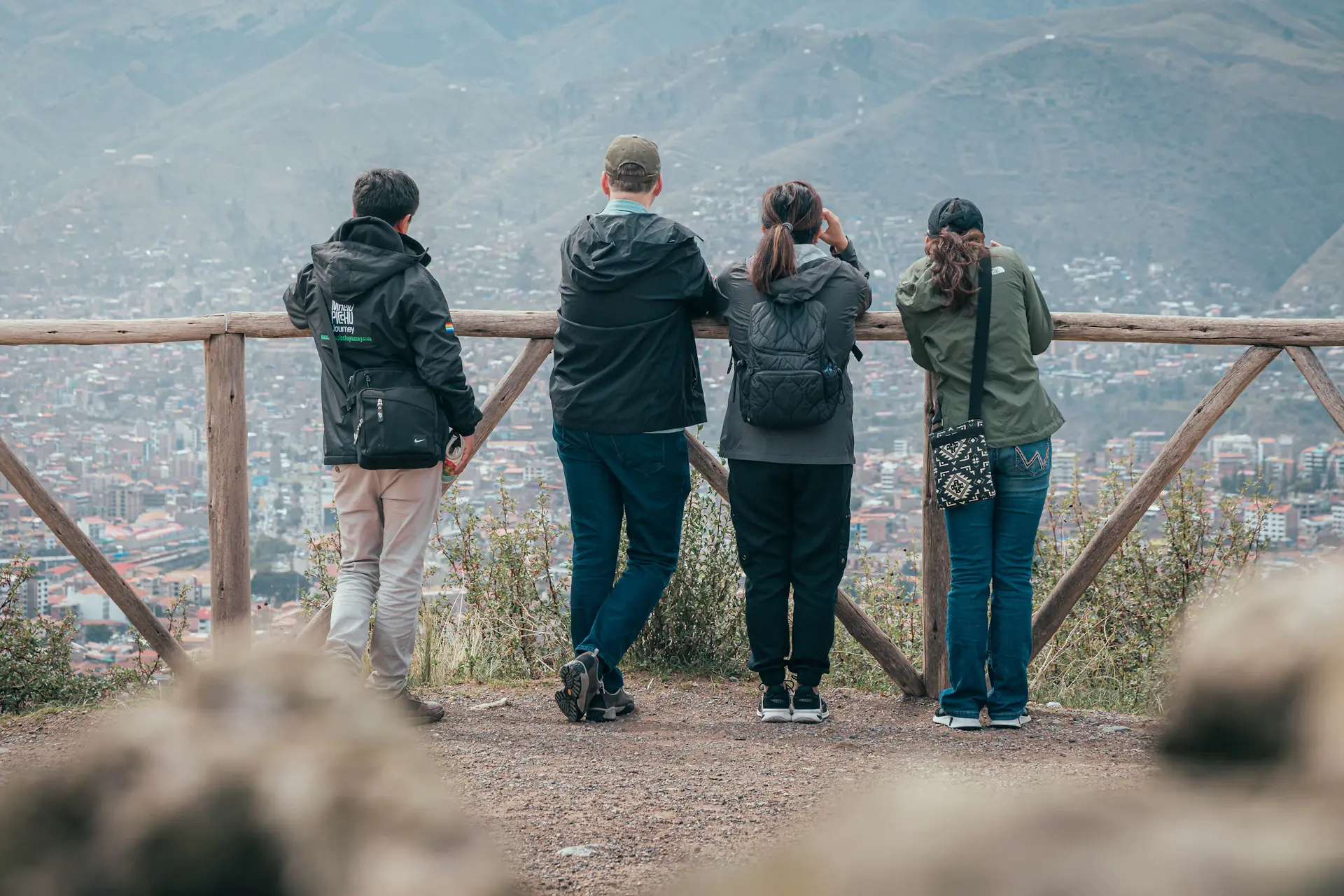 Friends taking a selfie at a scenic viewpoint