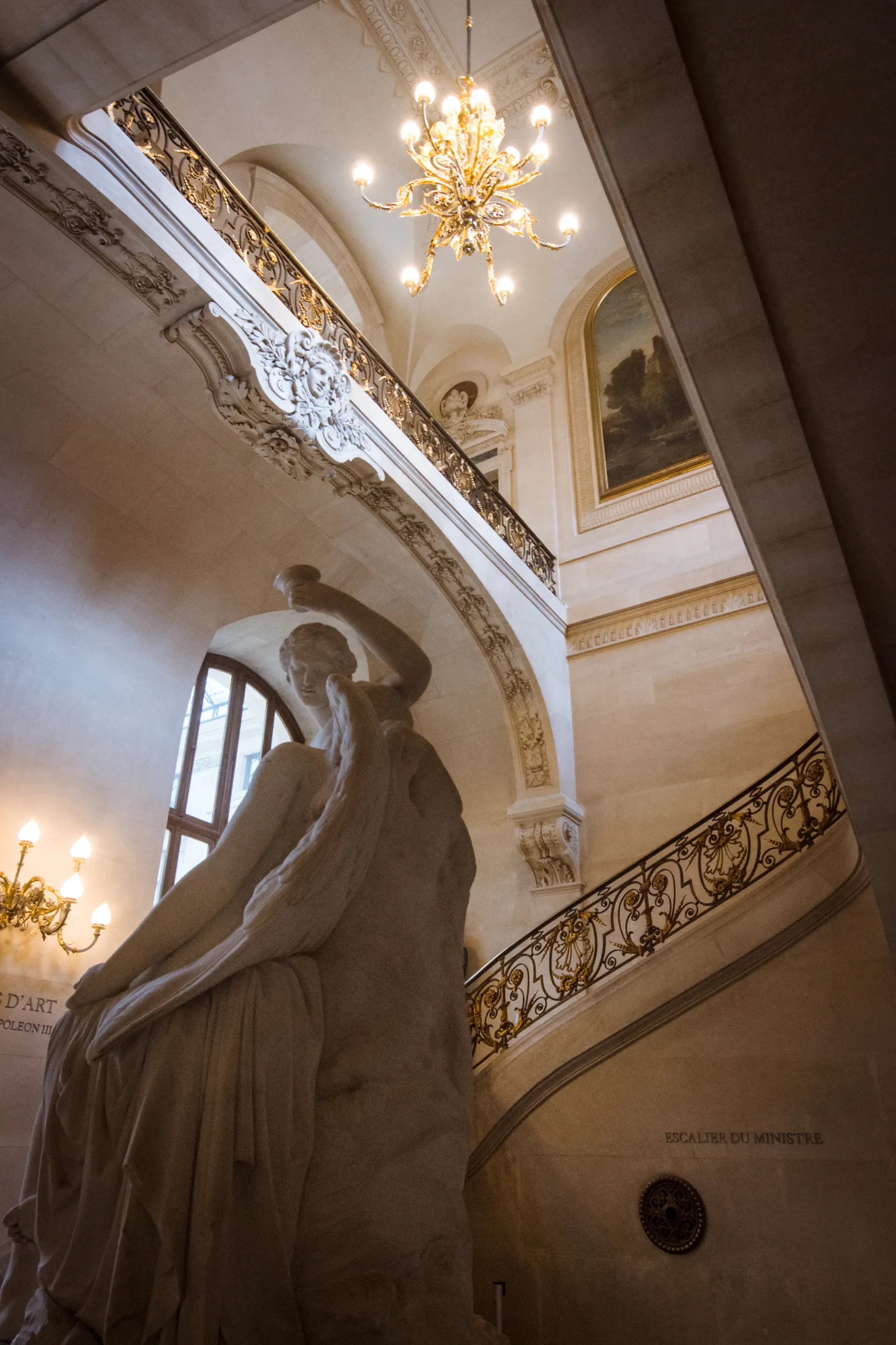 The bride in couture gown on the marble staircase