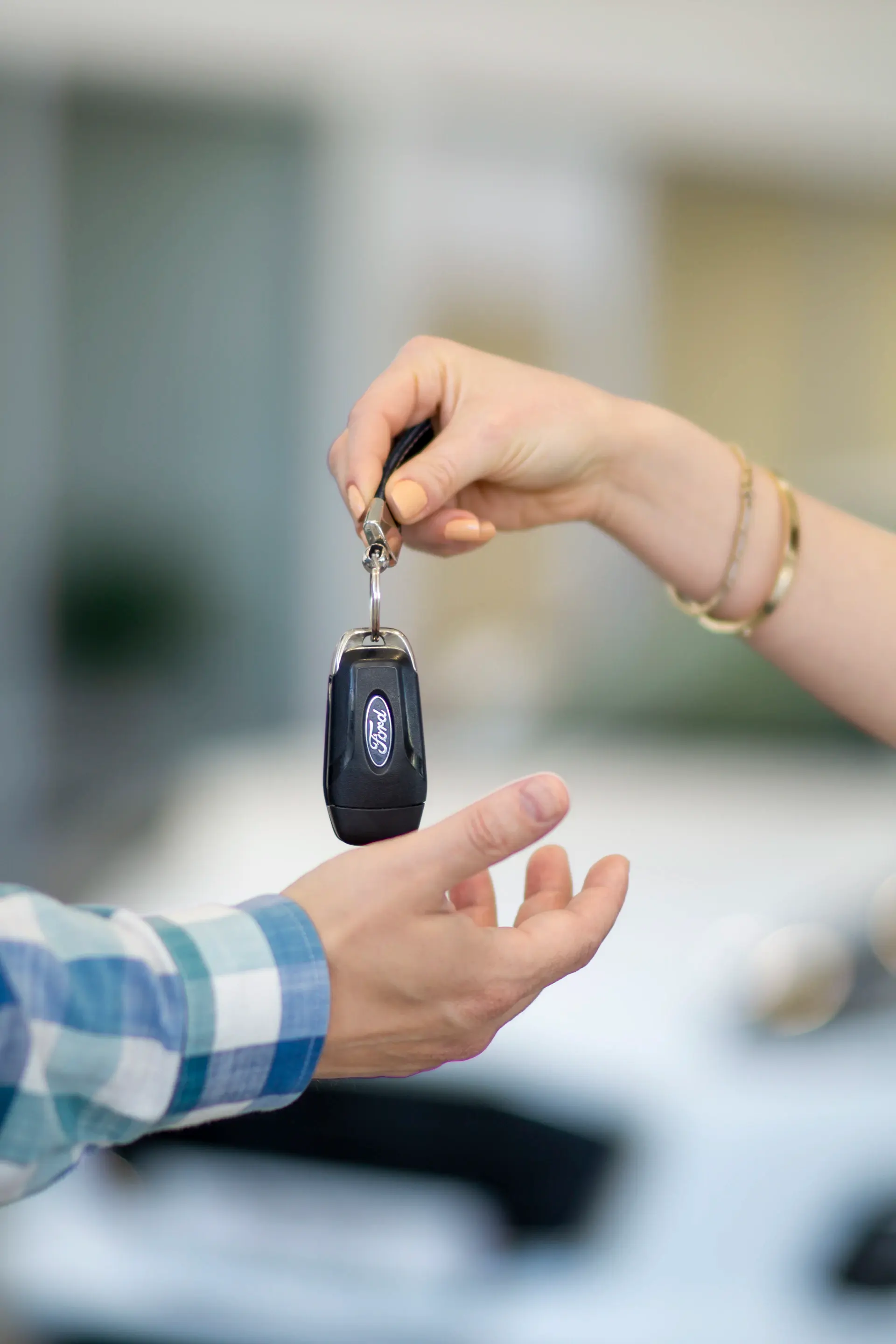 Concierge handing keys to a private client in an elegant setting