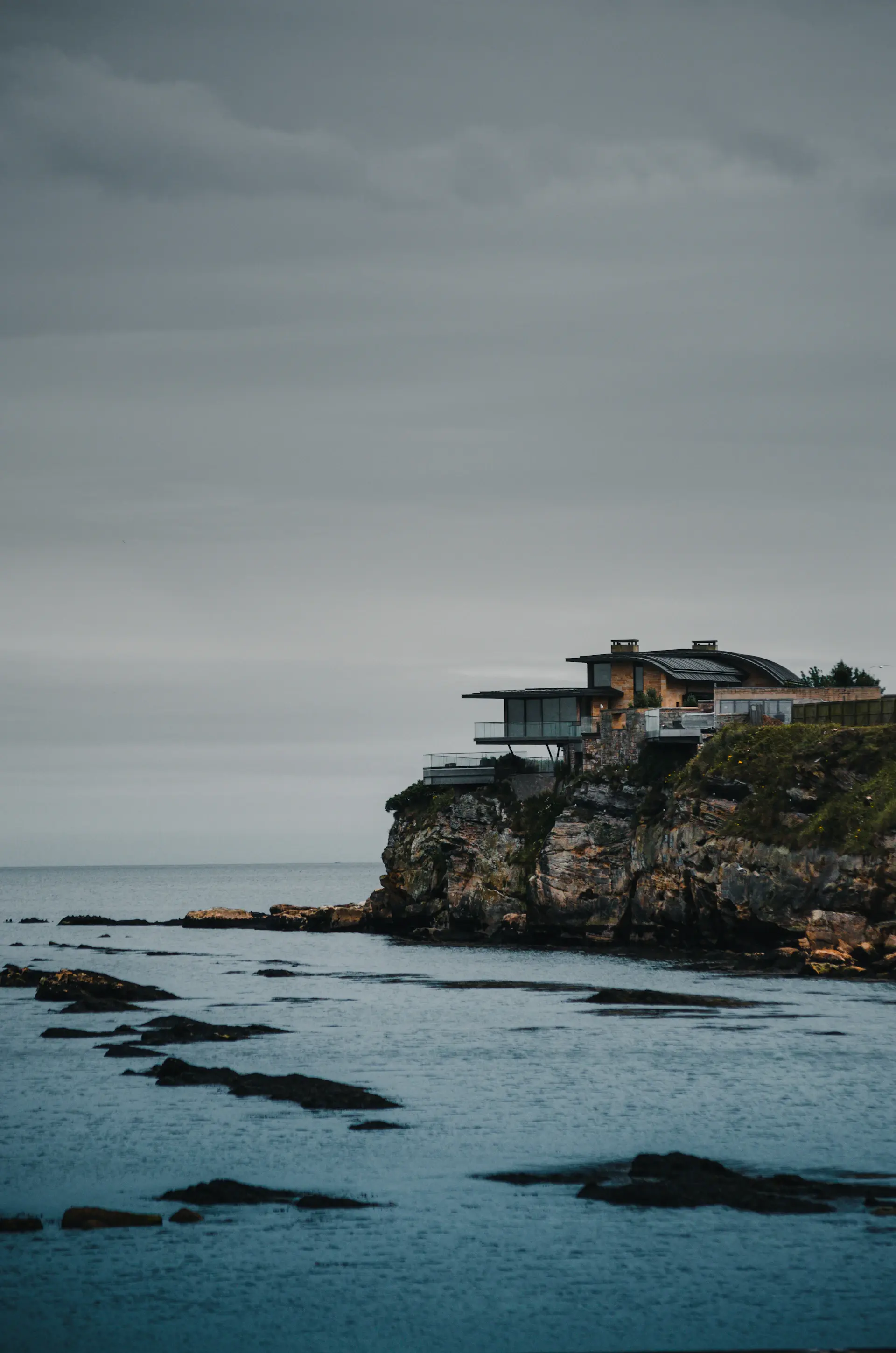 Modern cliffside villa with infinity pool overlooking the sea