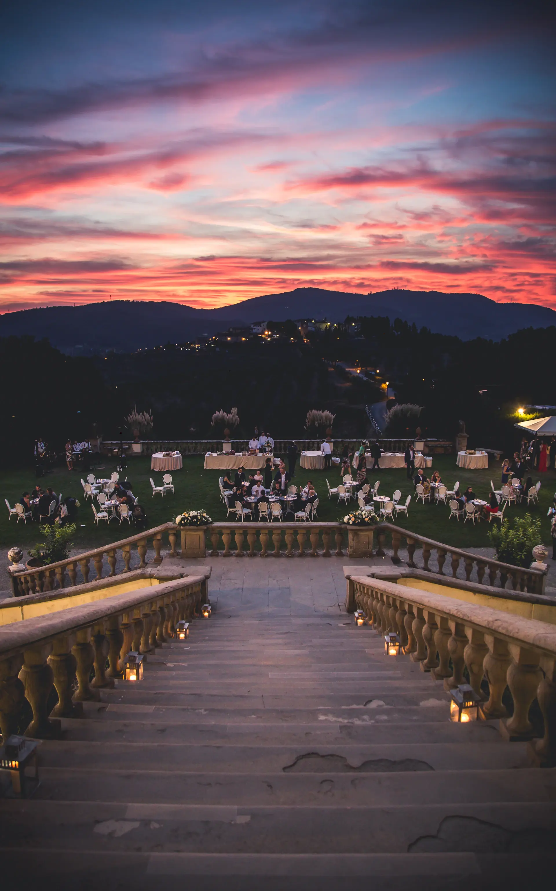A rooftop pavilion overlooking the city skyline at dusk