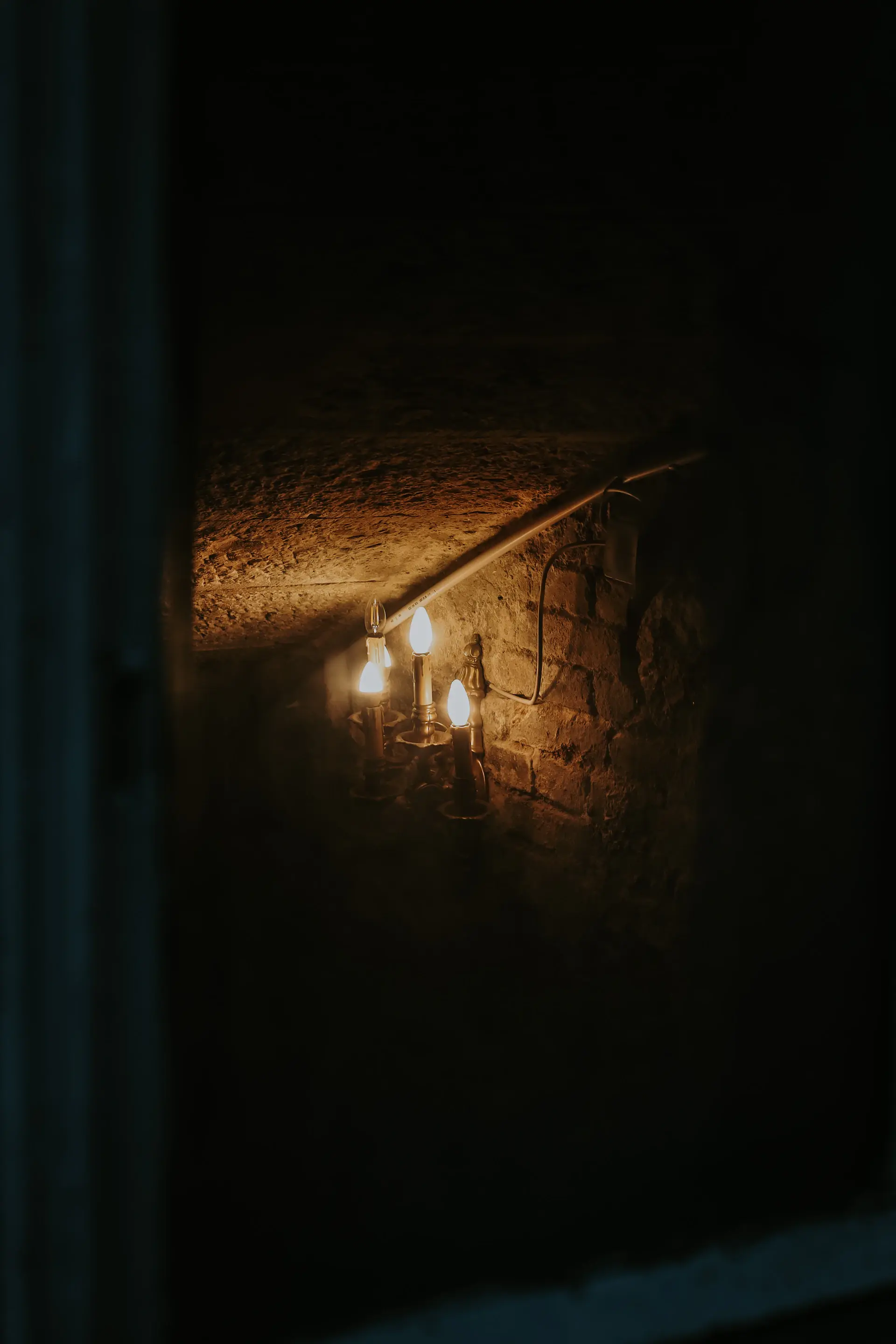 An intimate members' tasting in a candlelit private cellar