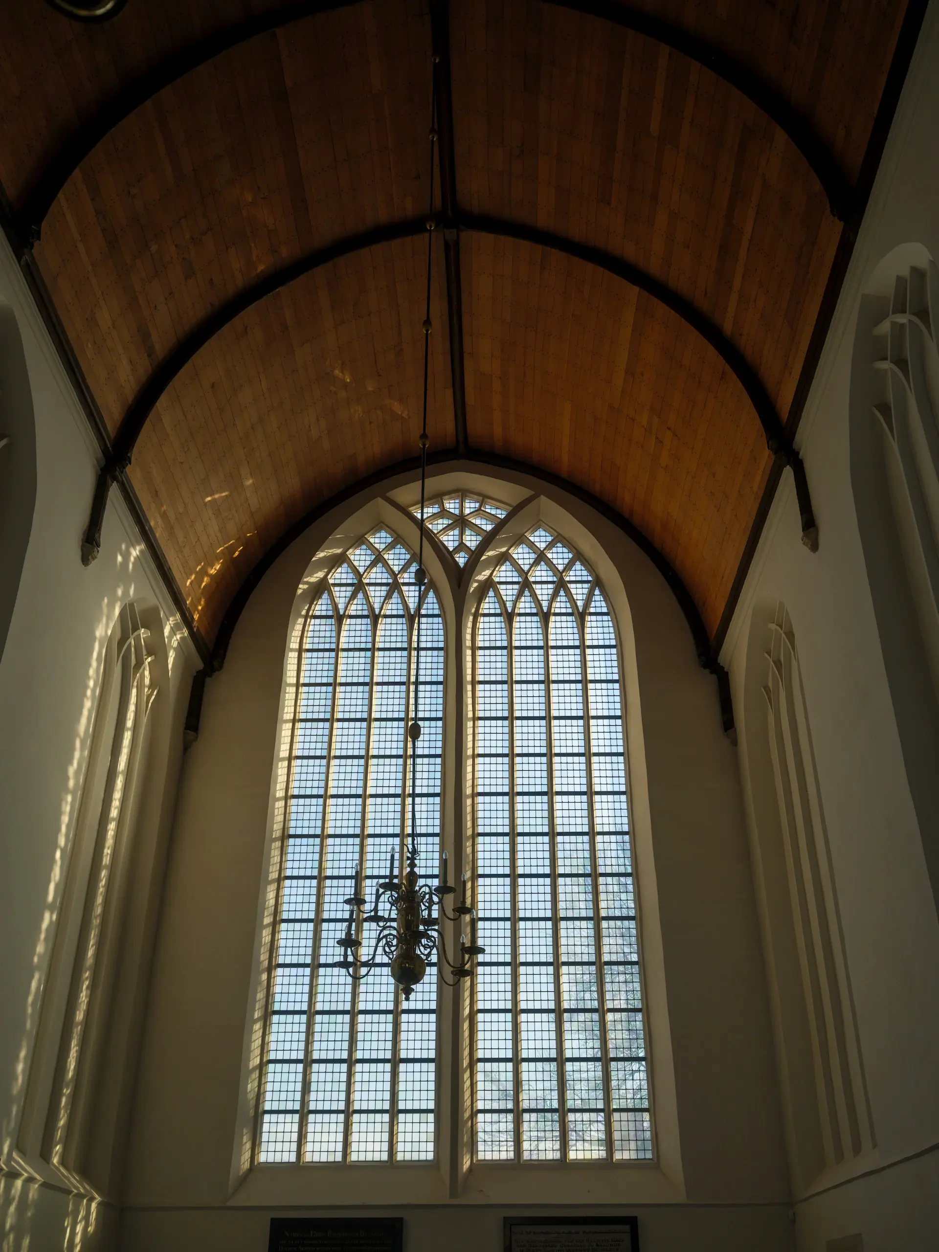 Intimate chapel hall with arched windows